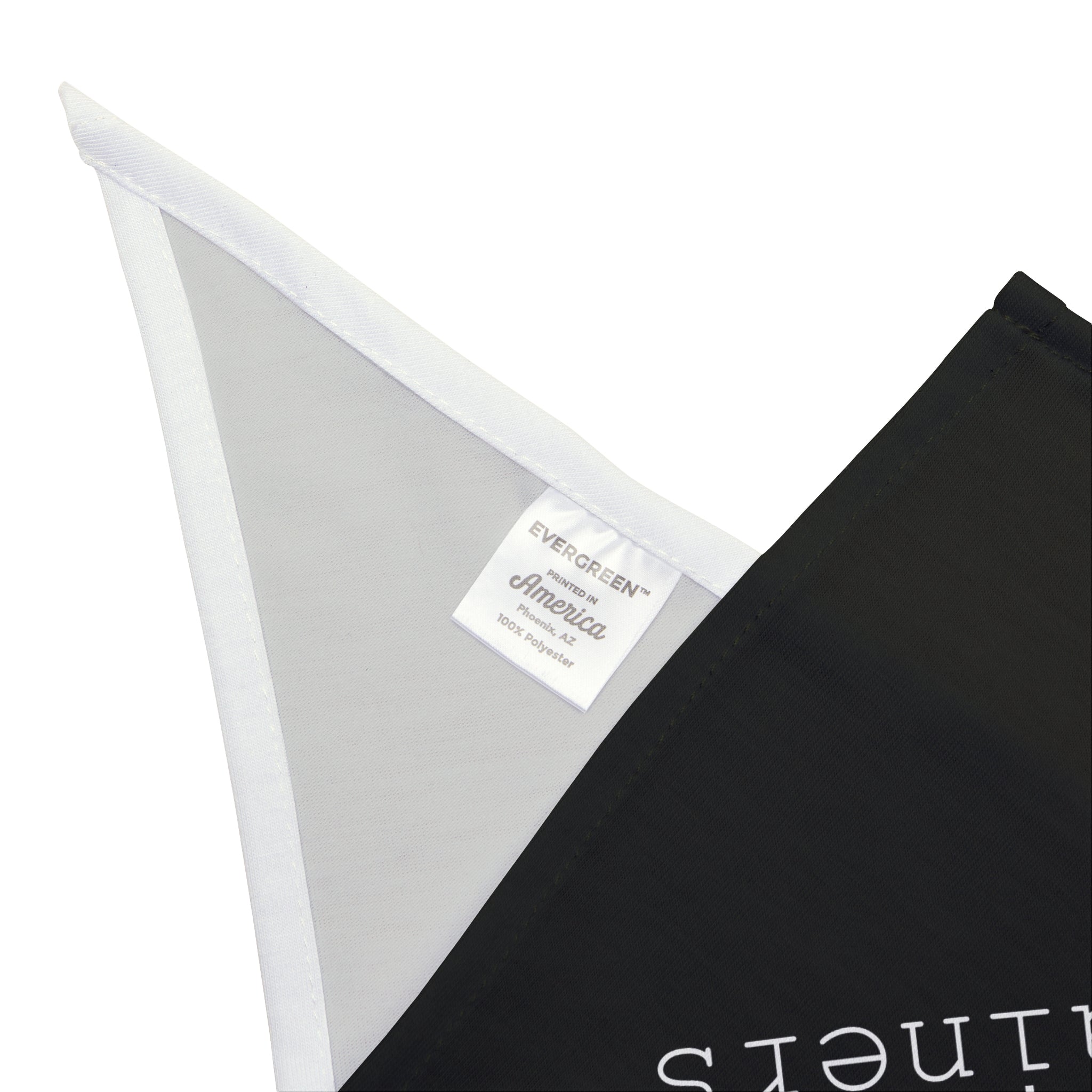 Close-up of a white tag on a black and white fabric corner, labeled "EVERGREEN America, 100% soft-spun polyester," making the Born to Run Containers - Pet Bandana the perfect accessory for your fur-baby.