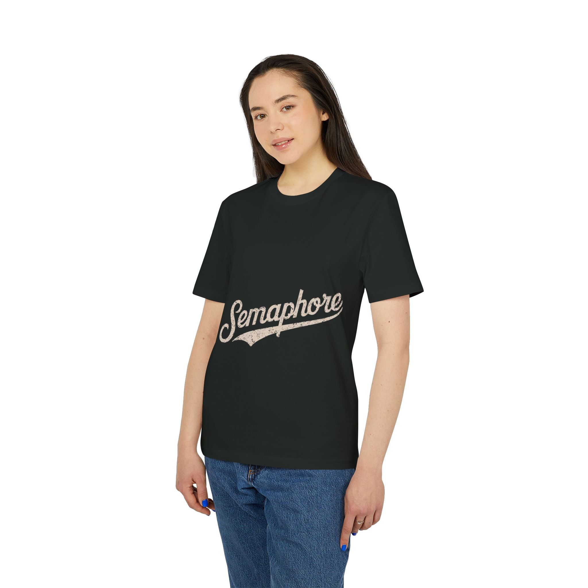 A person wears the Semaphore - Organic T-Shirt in black, featuring "Semaphore" in a script font across the front, paired with blue jeans.