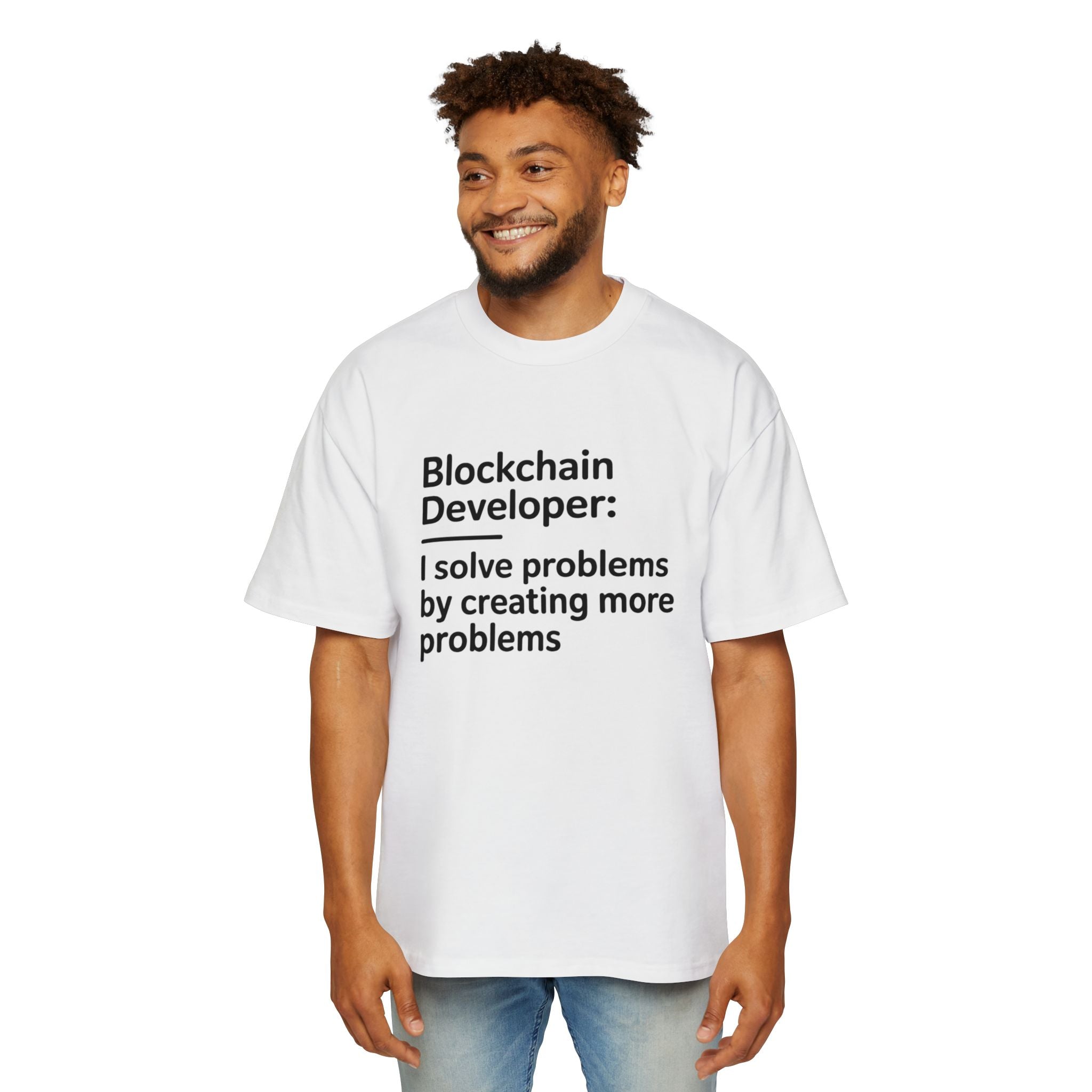 A man wears the "Blockchain developer - Heavy Oversized Tee," a white, 100% cotton oversized t-shirt featuring "Blockchain Developer: I solve problems by creating more problems" printed on the front.