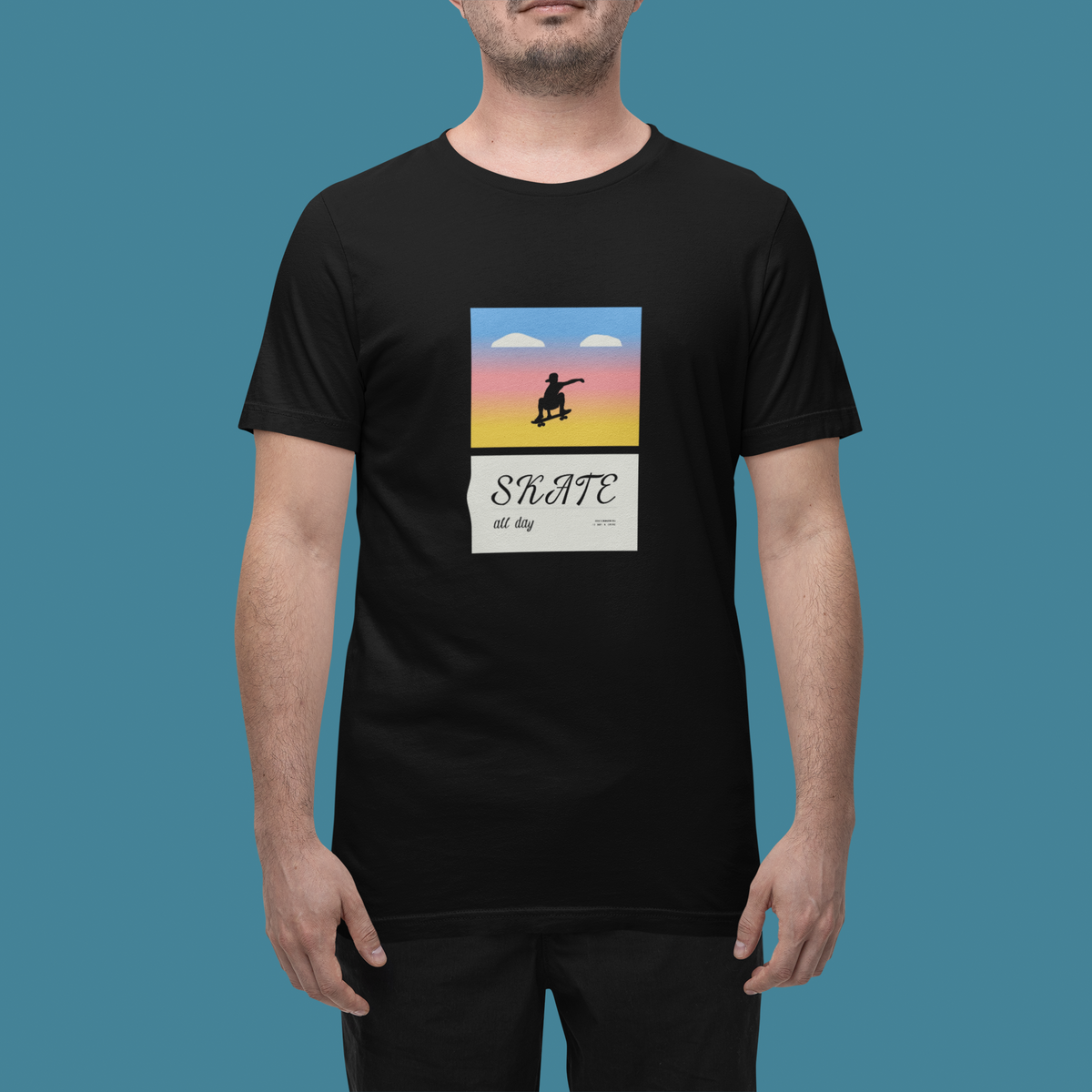 'Skate All Day' t-shirt in black, man wearing it in a studio, T-Shirt mockup, Geekpsters