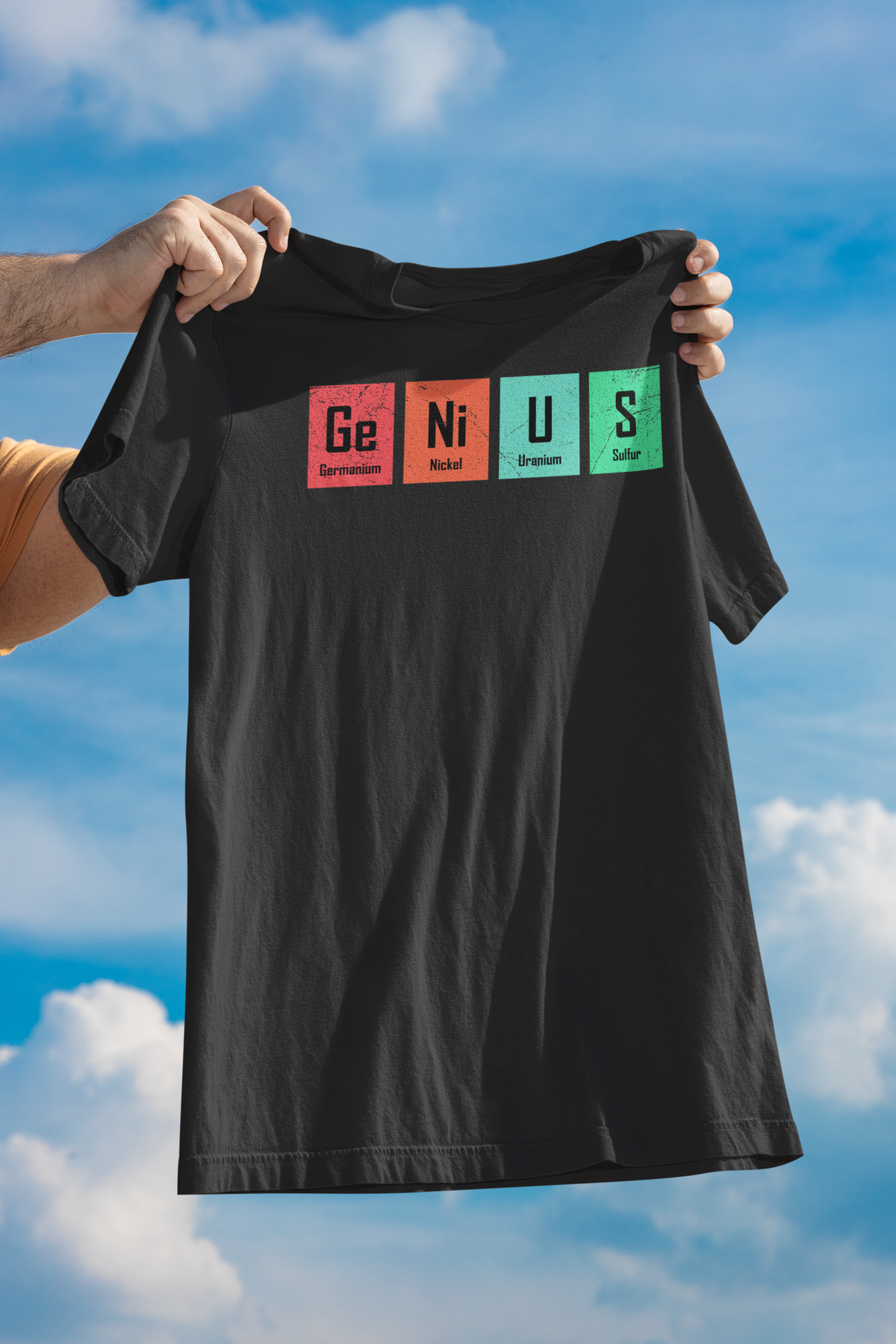 'Genius' periodic table pun women's tee in black, held up against sky, funny chemistry tee gift