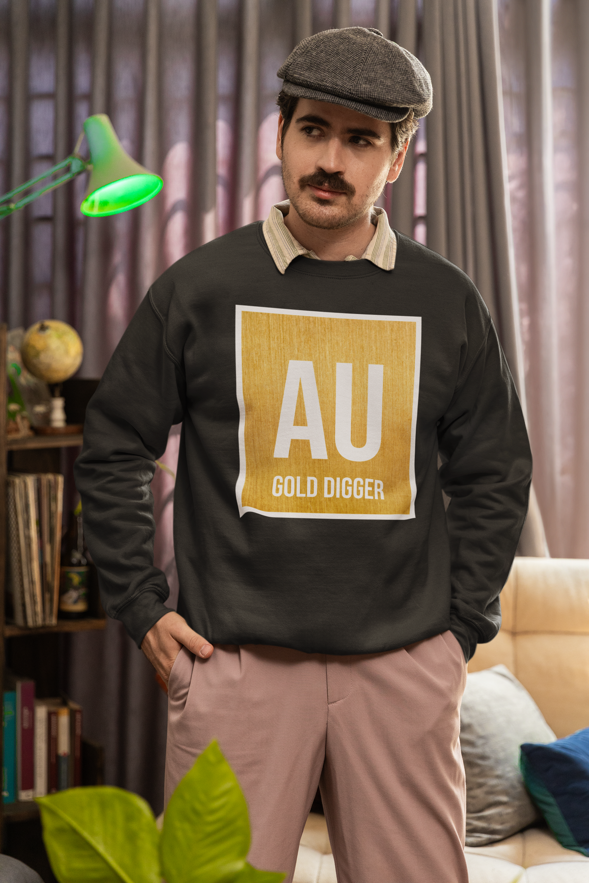 AU Gold Digger crewneck sweatshirt in charcoal, man in a flat cap wearing it indoors, funny gift
