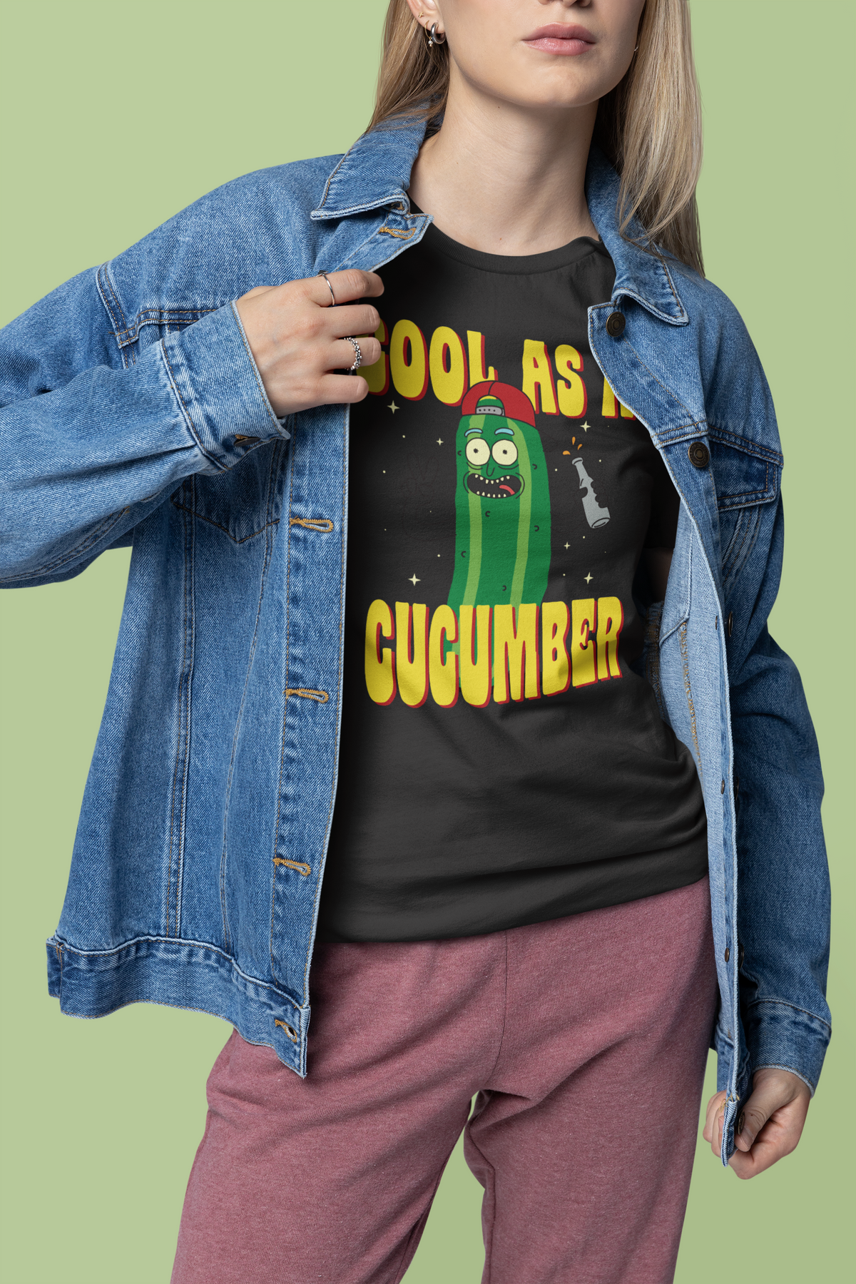 'Cool as a Cucumber' t-shirt in black, woman wearing it under denim jacket, funny foodie gift