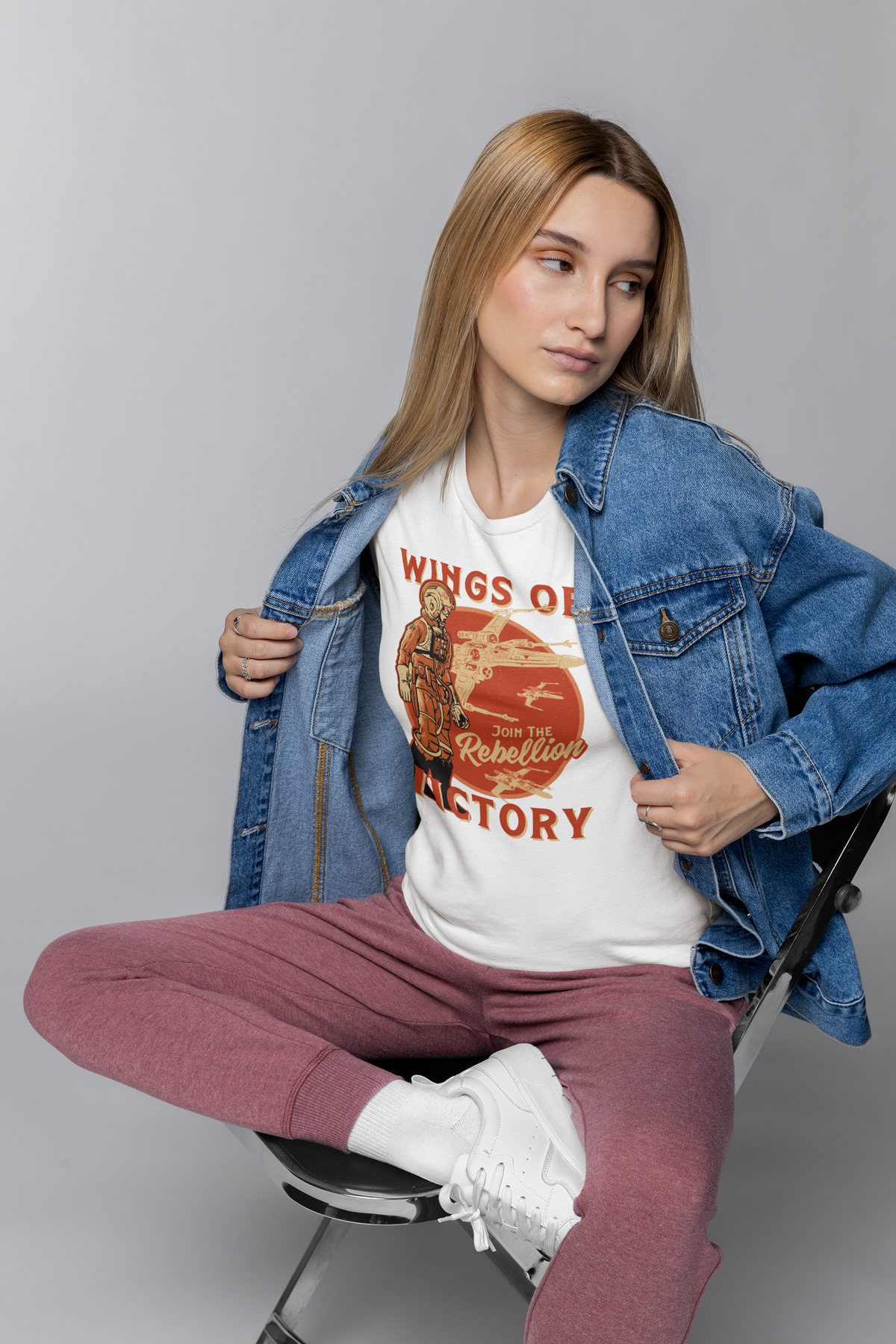 'Wings of Victory' rebellion t-shirt in white, woman wearing it with denim jacket, sci-fi fan style