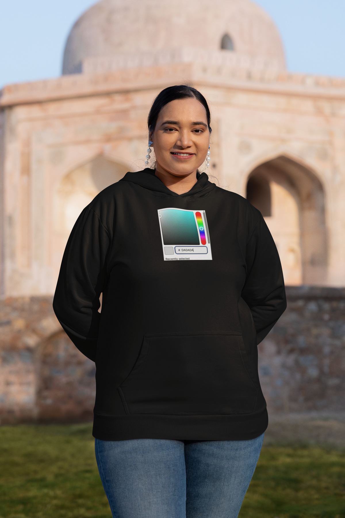 'DADA Paint Hoodie' in black, woman at a historic monument, Hoodie mockup, Geekpsters