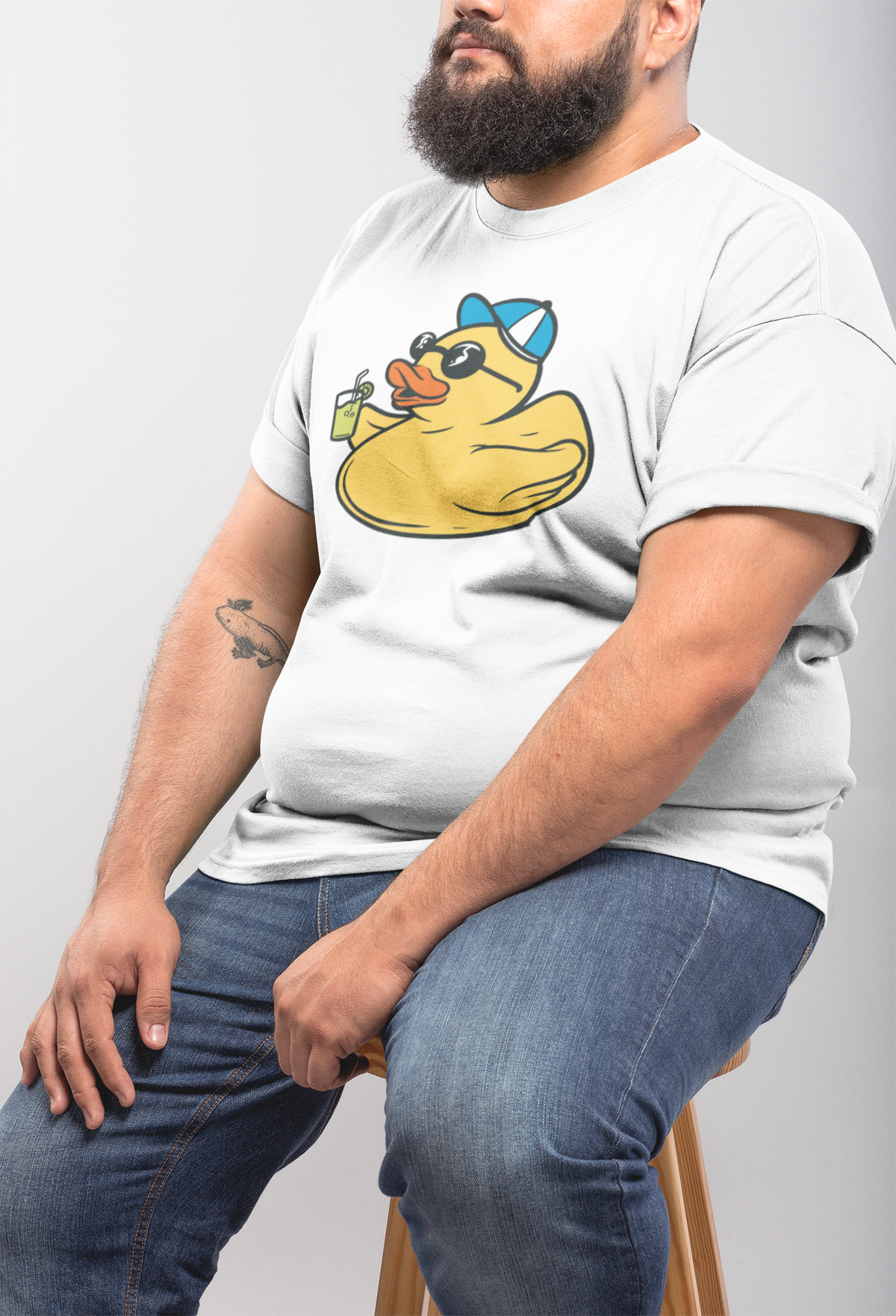 Vacation duck t-shirt in white, heavyset man model seated wearing it, funny beach vacation gift