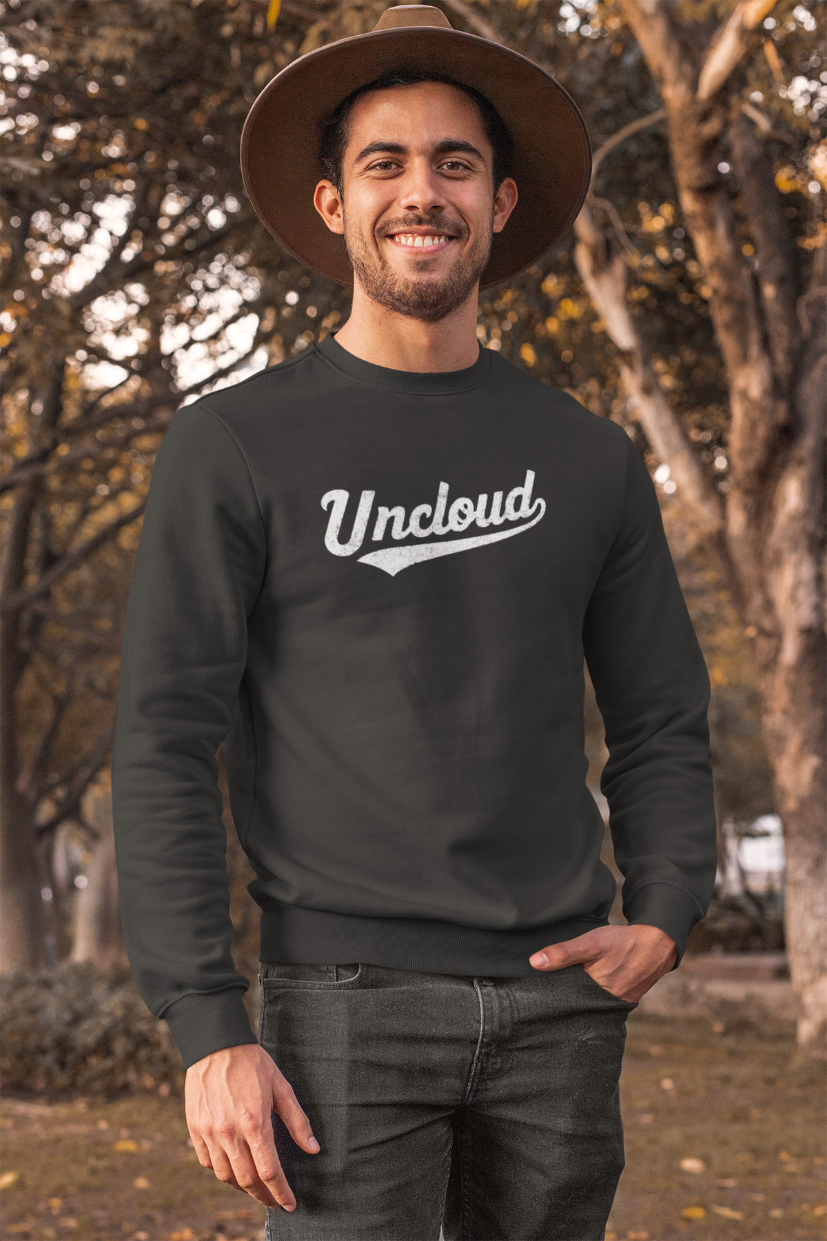 Uncloud script logo sweatshirt in black, man wearing it outdoors in a hat, funny gift for him
