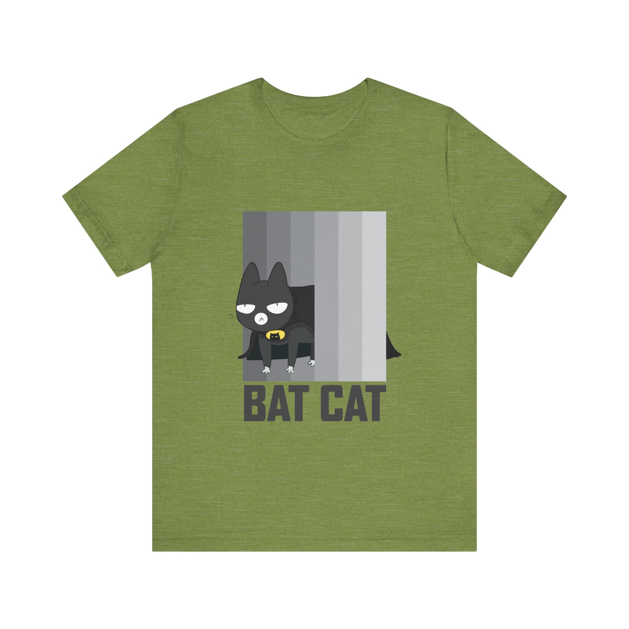 The BATCAT T-Shirt, made from soft cotton, features a fun cartoon depicting a cat dressed as a bat sitting on a ledge. Designed for all, this unisex tee blends comfort with a playful flair.
