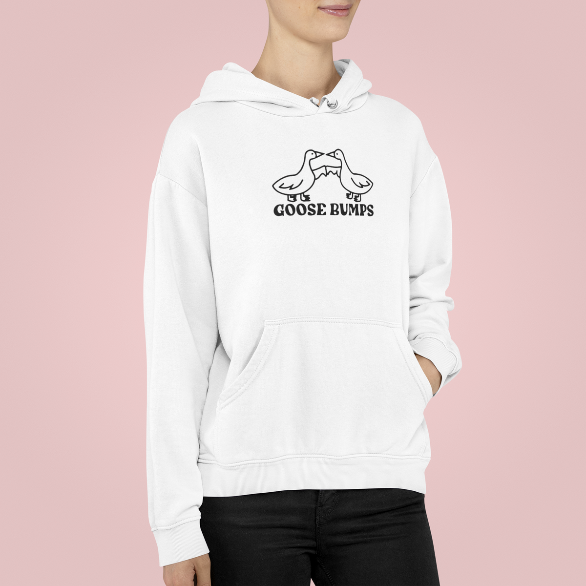 "Goose Bumps" hoodie in white, woman wearing it on pink backdrop, funny pun gift hoodie