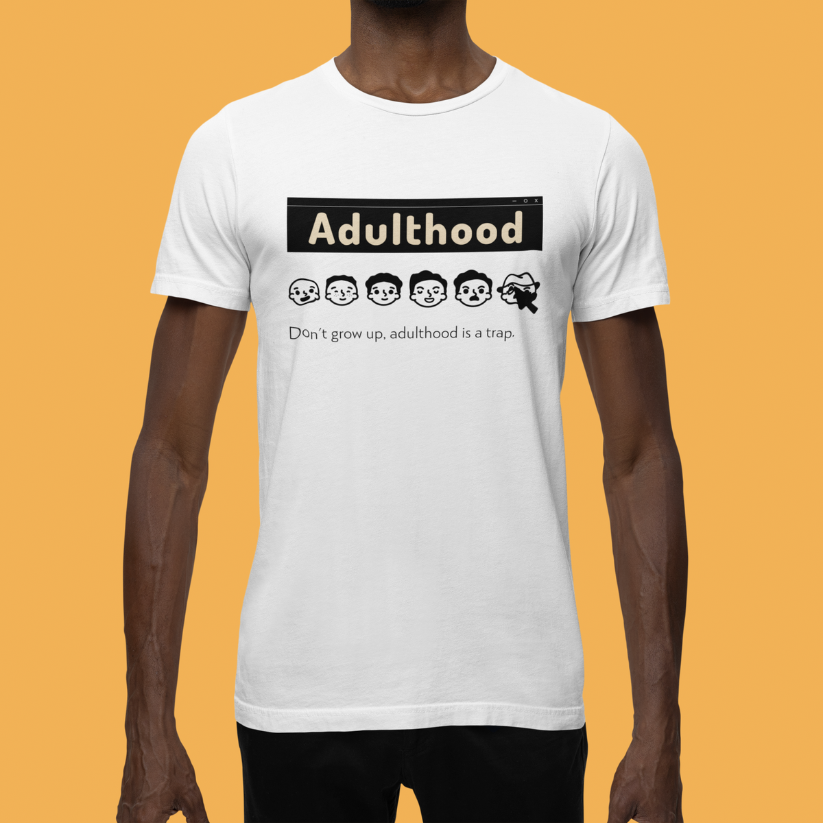 'Adulthood is a Trap' t-shirt in white, man wearing it on mustard backdrop, funny sarcastic gift