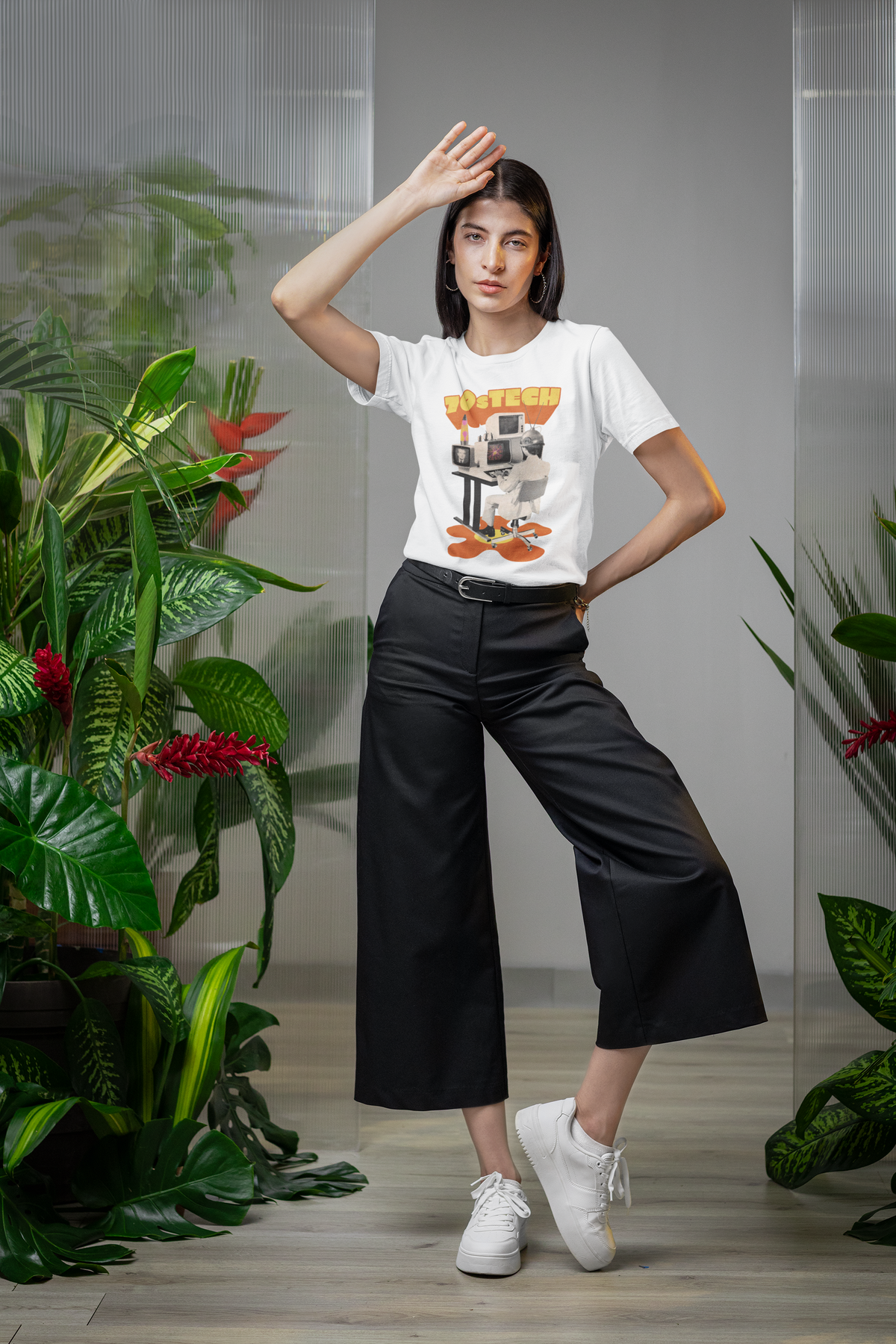 '70s Tech' t-shirt in white, woman model wearing it among green plants, funny retro computer gift