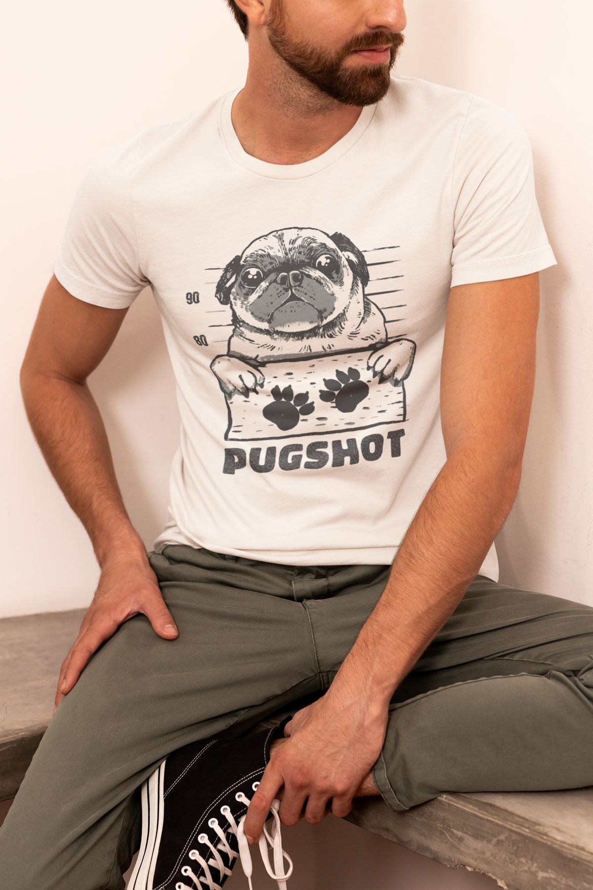Pugshot T-shirt in white, man wearing it in a casual pose, funny pug lover gift shirt