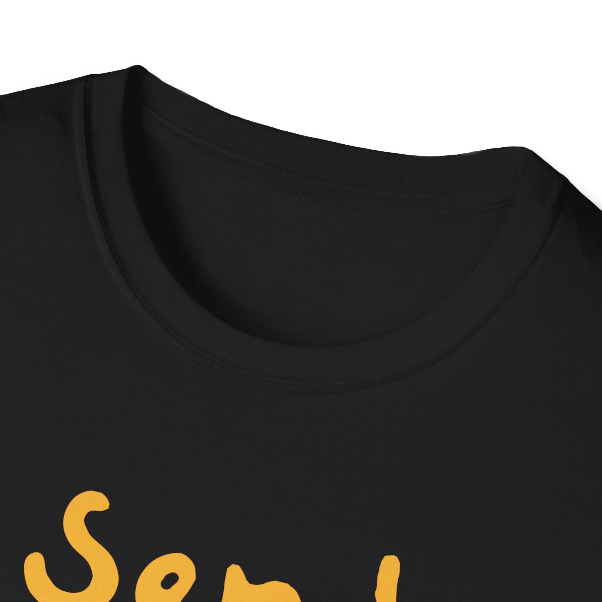A close-up view of the black Send Noods T-Shirt, showcasing its stylish fit with a glimpse of the yellow "Send Noods" script at the bottom.