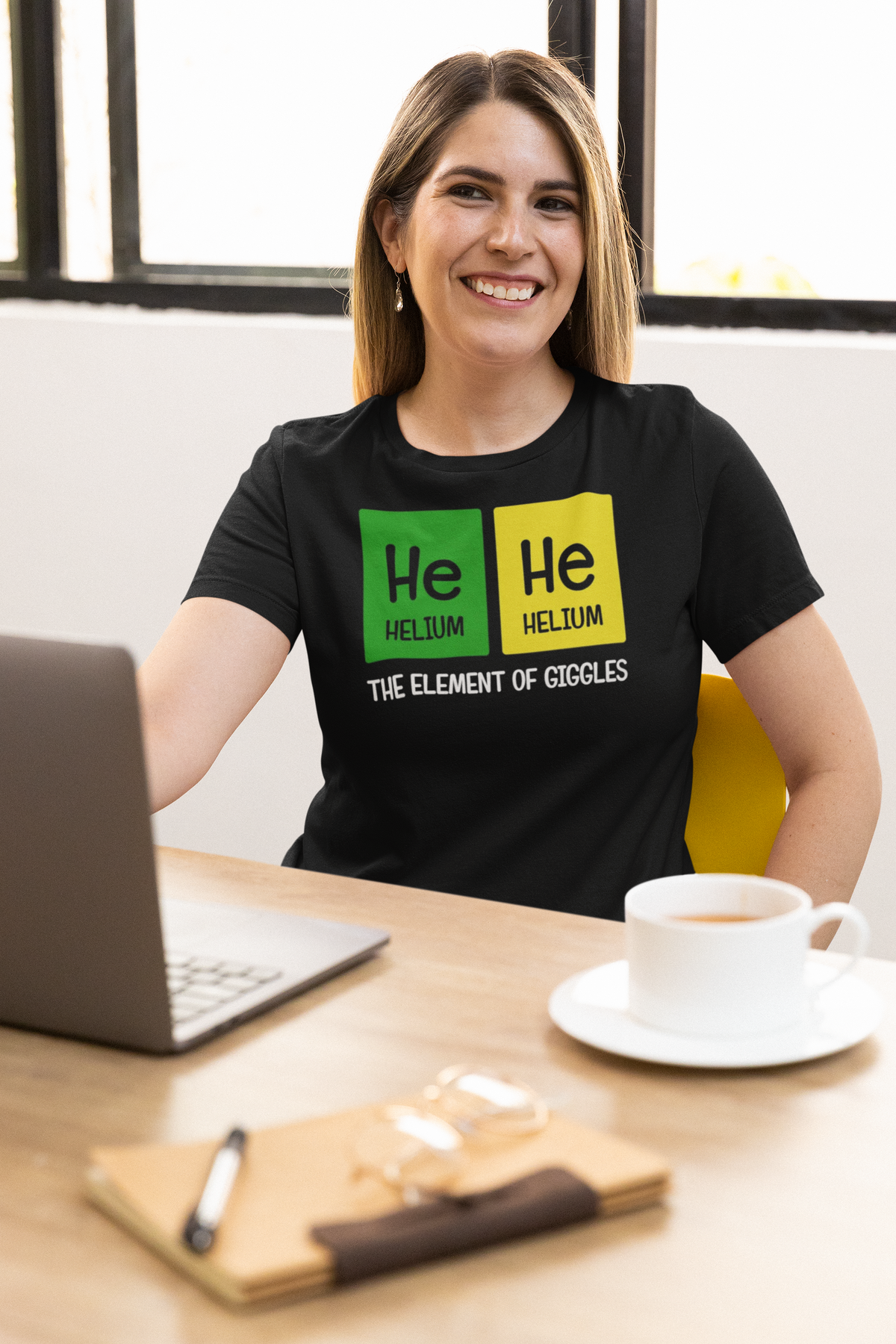 'He-He' women's t-shirt in black, woman wearing it at the office, T-Shirt mockup, Geekpsters