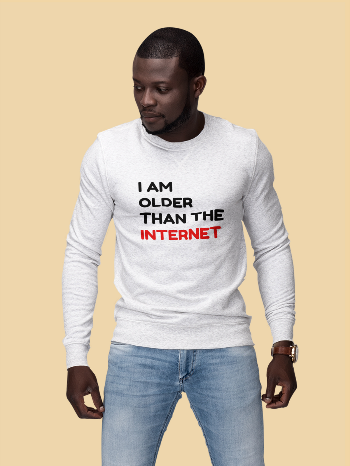'I Am Older Than the Internet' sweatshirt in white, woman wearing it against a yellow backdrop, funny statement gift