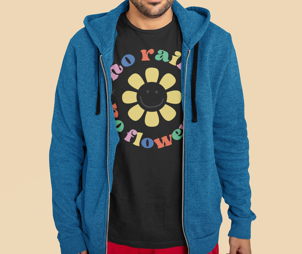 'No Rain No Flowers' t-shirt in black, man in a blue hoodie wearing it