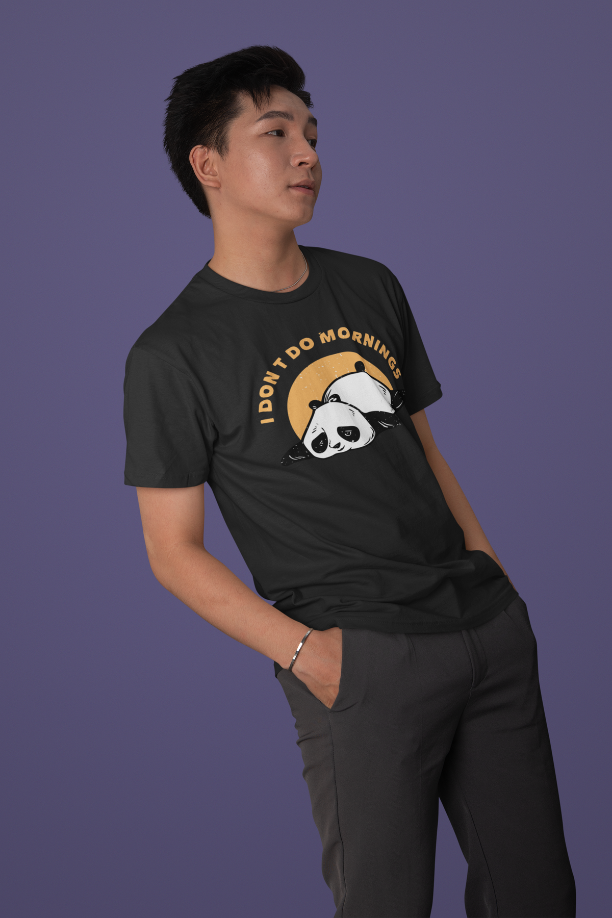 'I Don't Do Mornings' panda t-shirt in black, man wearing it against purple backdrop, funny sunrise gift