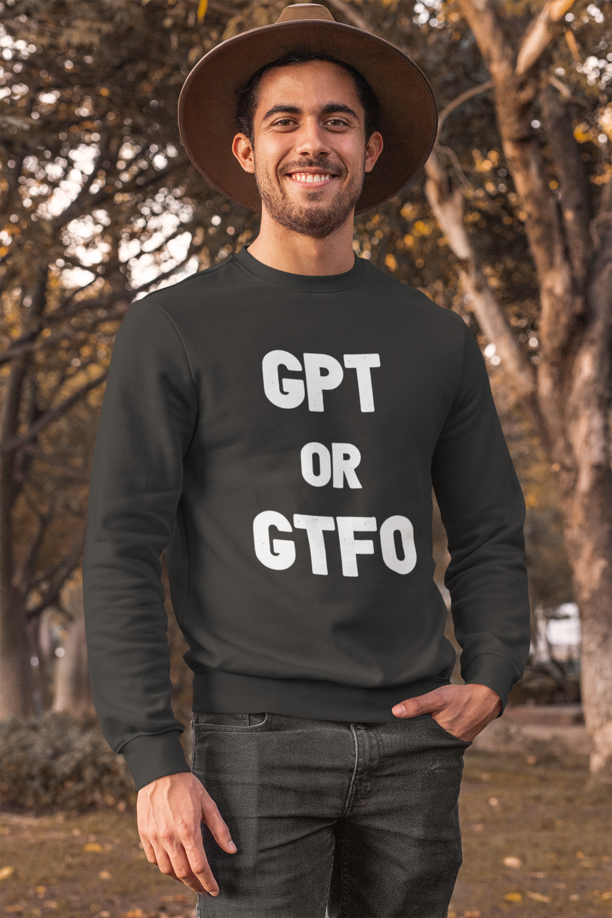 'GPT or GTFO' sweatshirt in dark heather, man wearing it outdoors with hat, funny gift for programmers