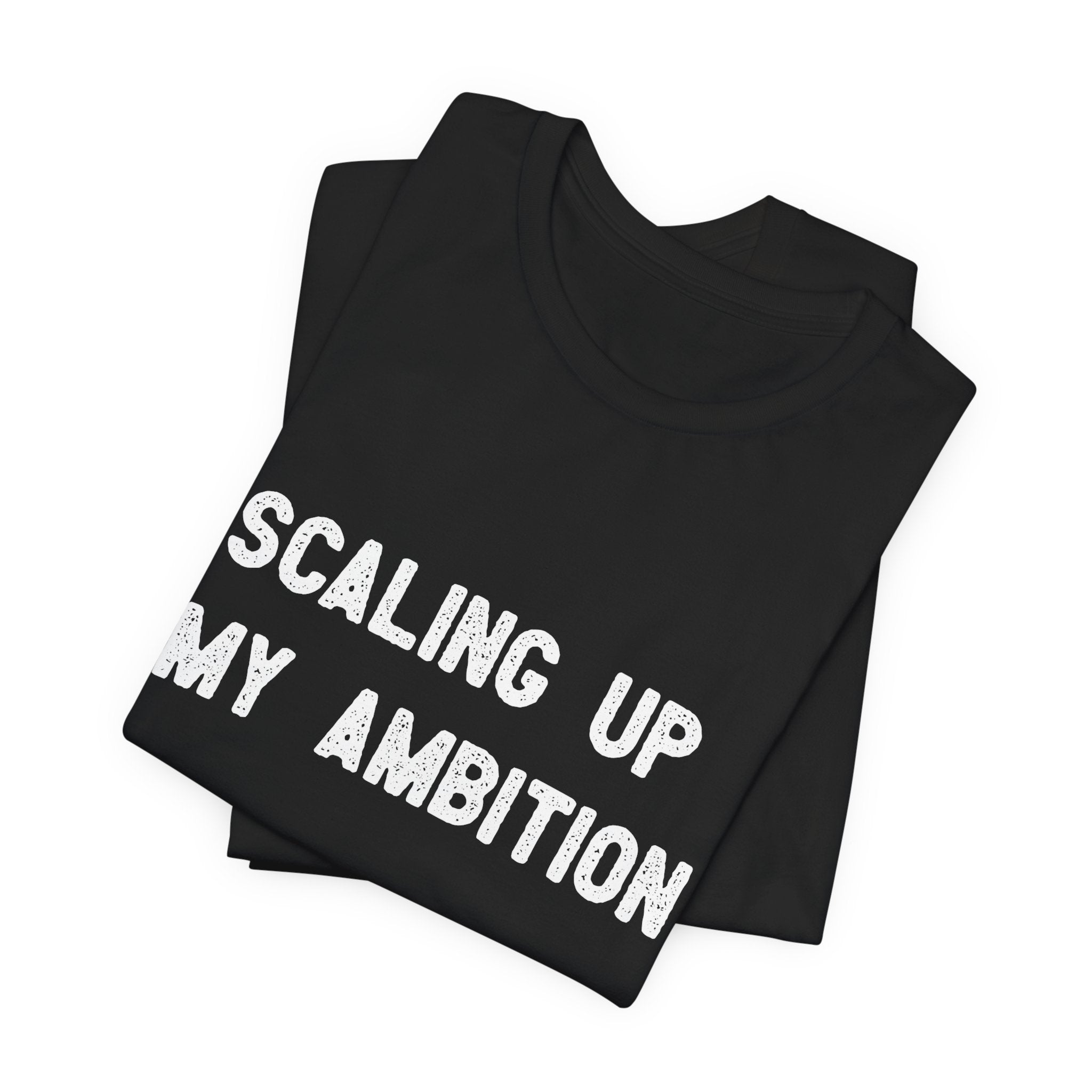 Two "Scaling Up My Ambition" t-shirts, made from durable black Airlume cotton, have the text prominently printed in white on the top garment.