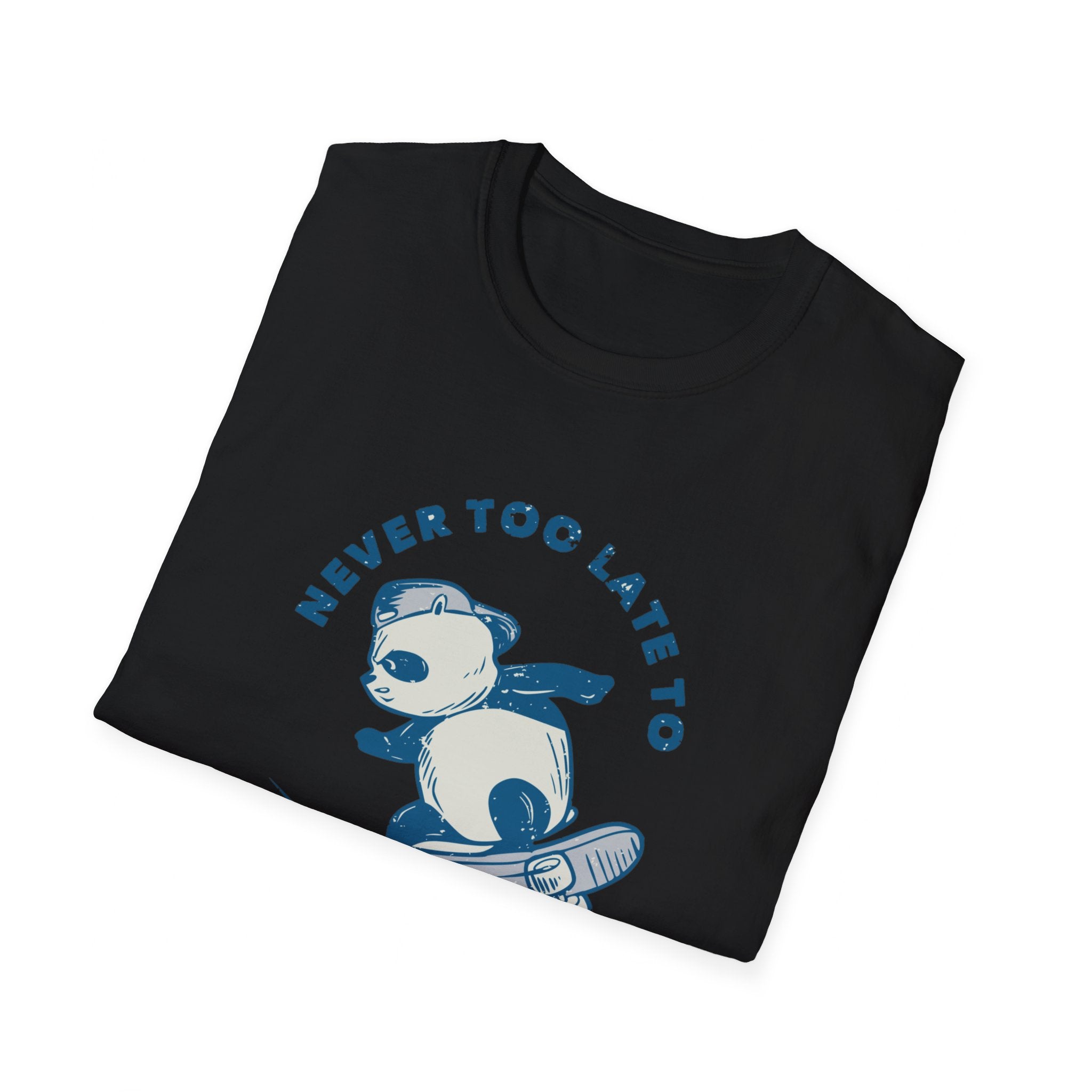 The Never Too Late to Skate T-Shirt, in a folded black design, showcases a lively panda skateboarding and highlights the phrase "Never Too Late to Skate" in bold blue text. Ideal for skate enthusiasts, it captures the playful essence and enduring charm of skating.