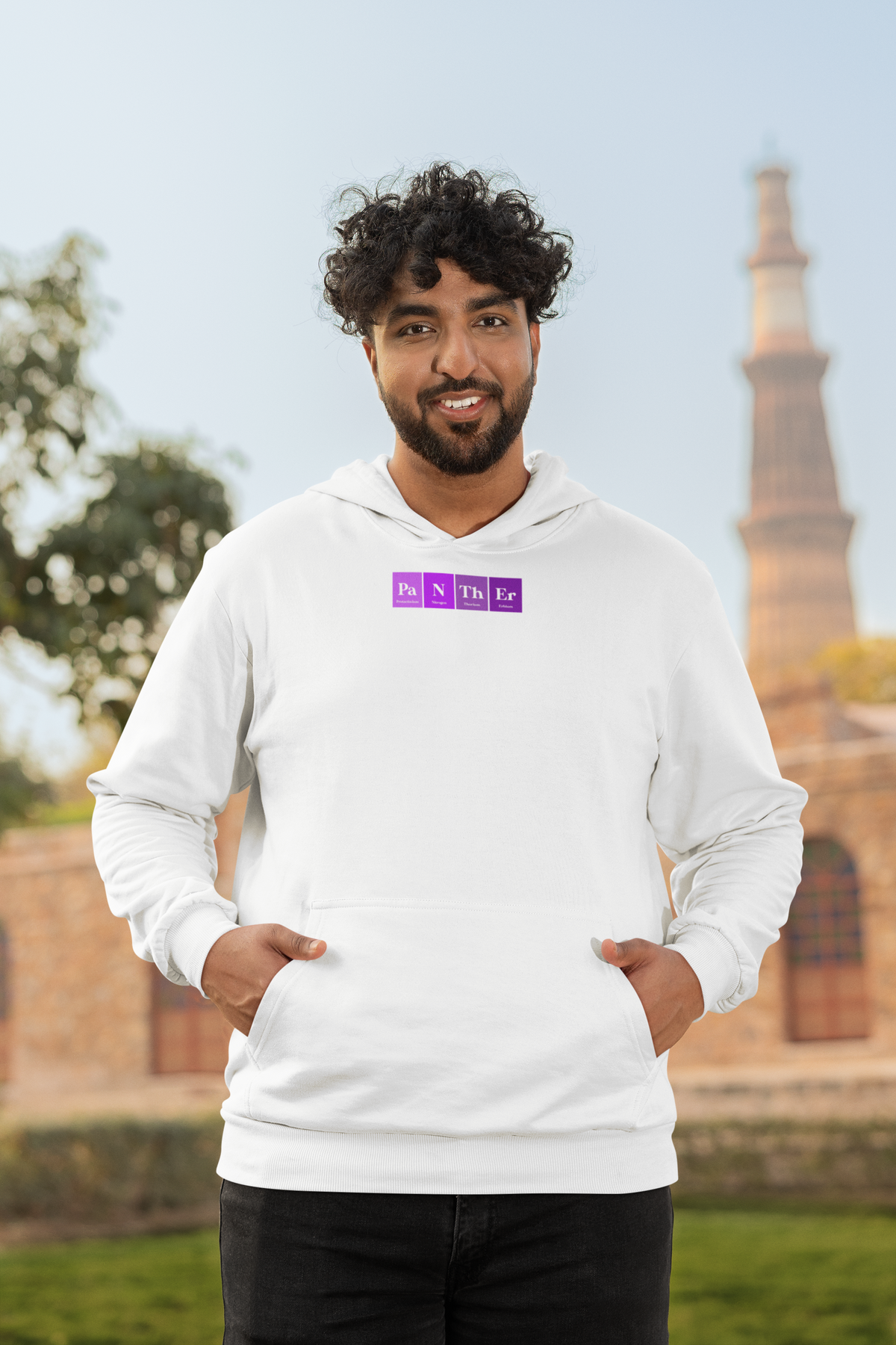 'Pa-N-Th-Er Periodic Table Hoodie' in white, man by a historic building, Hoodie mockup, Geekpsters