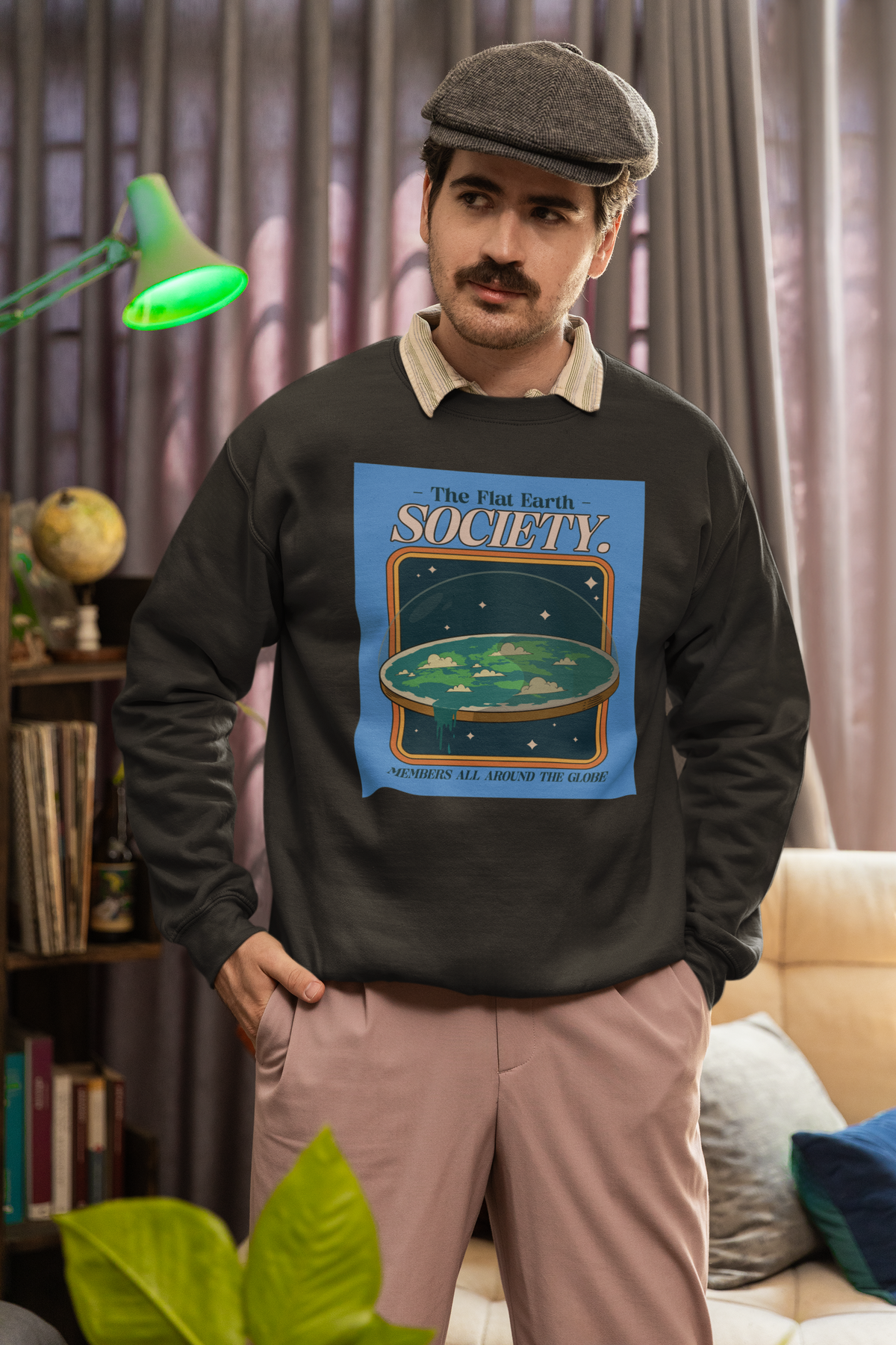 'The Flat Earth Society' sweatshirt in charcoal, mustached man wearing it, funny science satire gift