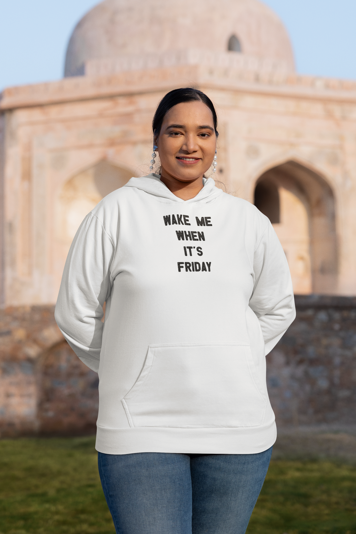 Wake Me When It's Friday weekend text pullover hoodie, model wearing it in a studio shot