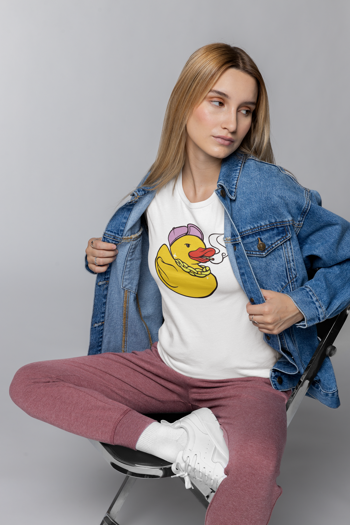 Punk duck t-shirt in white, woman model wearing it under an open denim jacket, funny rebel animal gift