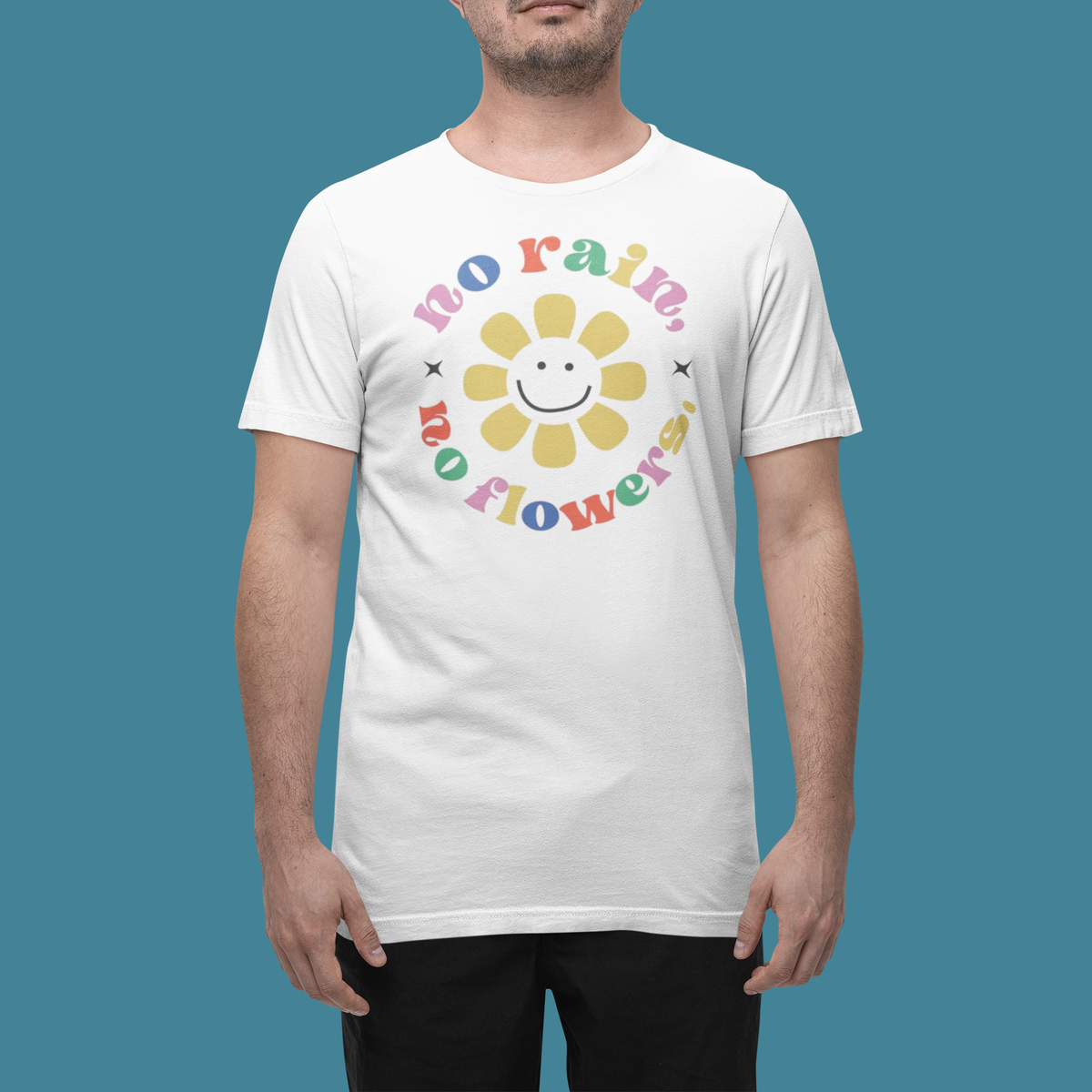 'No Rain No Flowers' t-shirt in white, man wearing it in a studio, T-Shirt mockup, Geekpsters