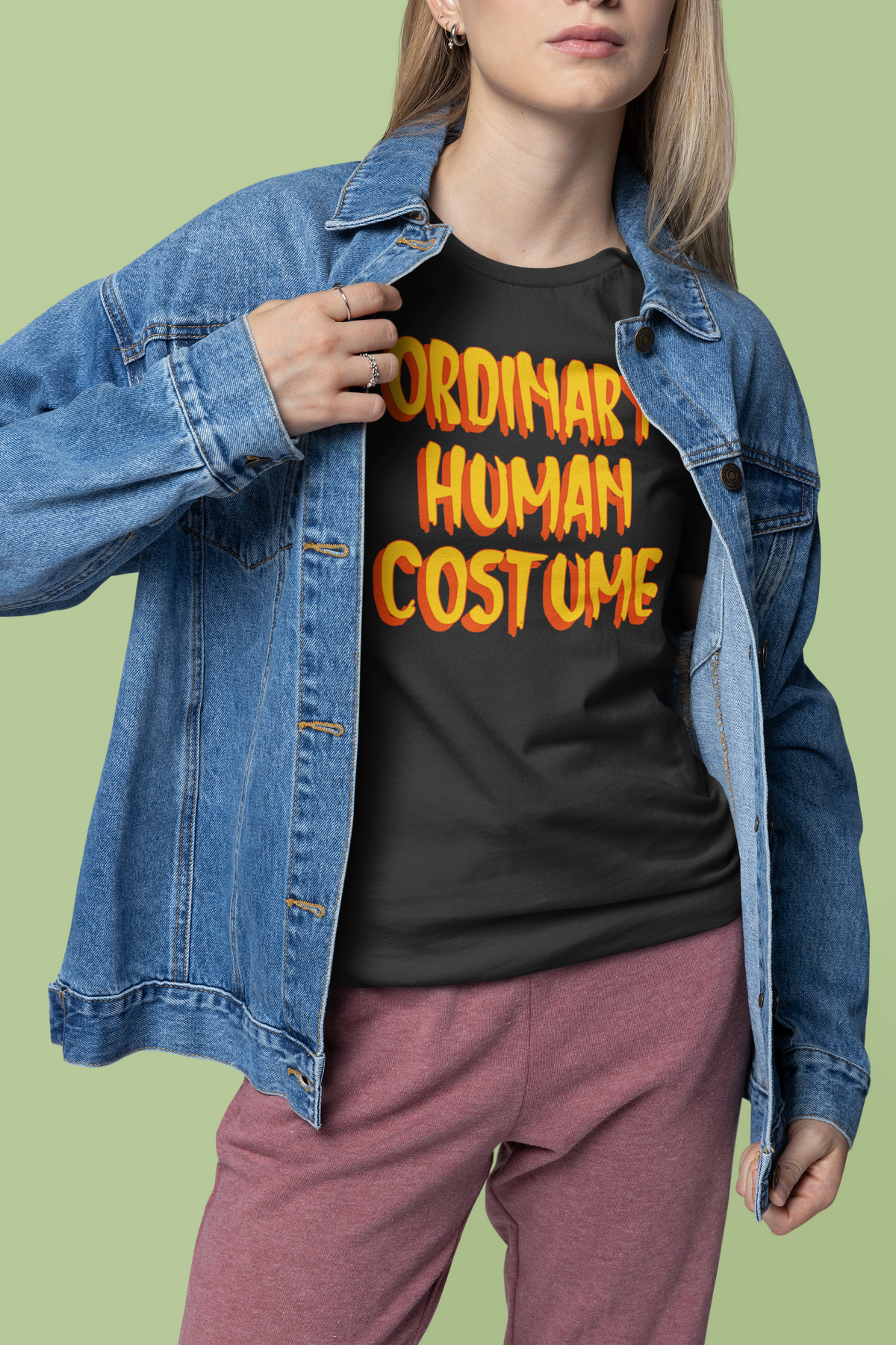 'Ordinary Human Costume' funny halloween t-shirt in black, woman wearing it with denim jacket, gift