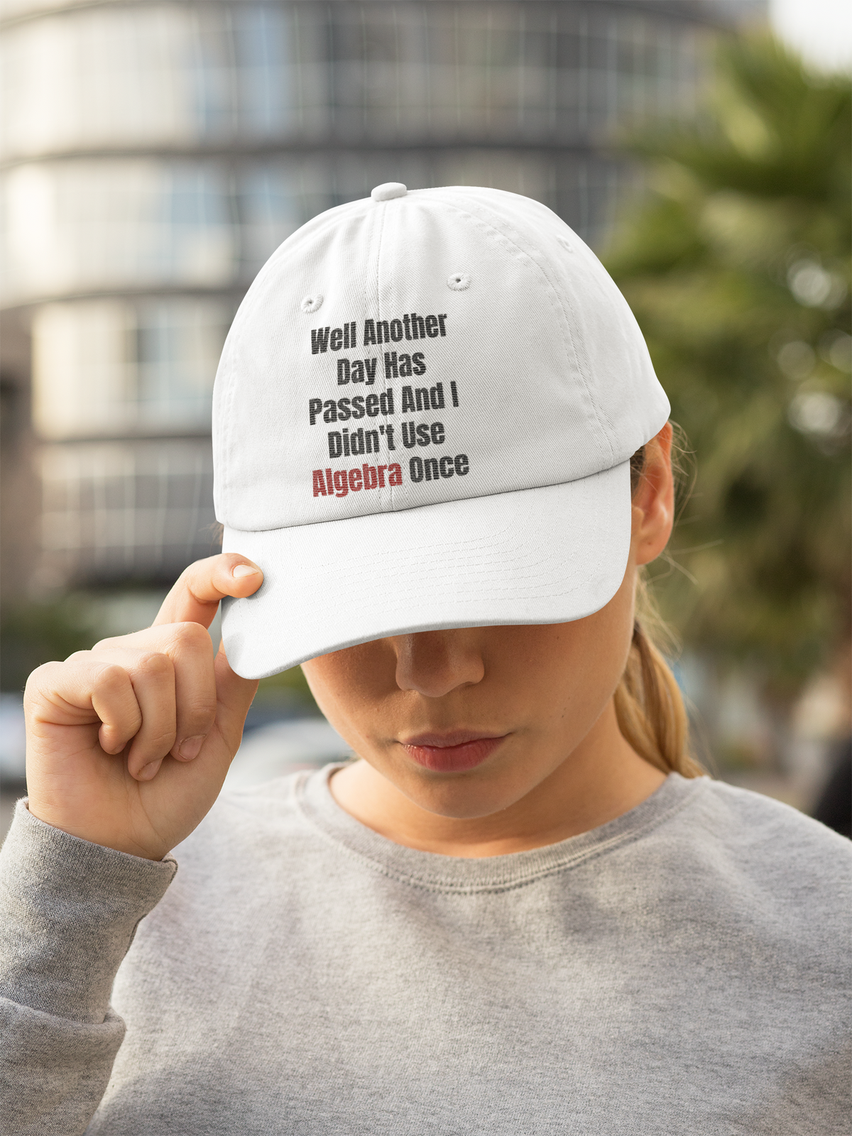 "Well Another Day Has Passed And I Didn't Use Algebra Once" dad hat in white, woman tilting head