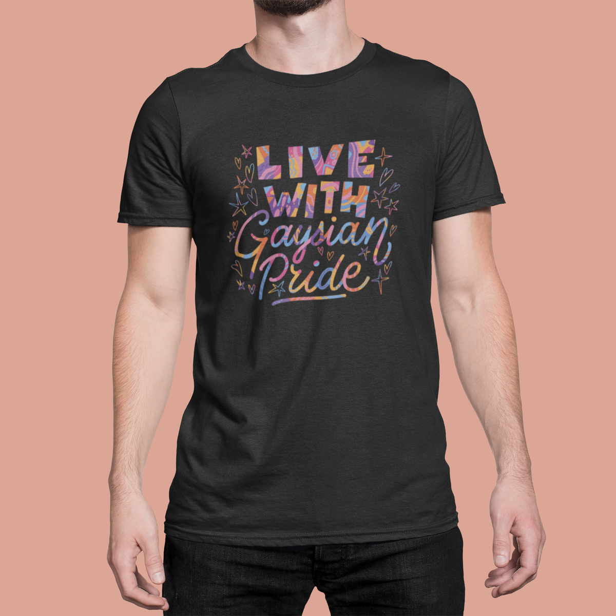 'Live with Gaysian Pride' T-shirt in black, man wearing it against a pink backdrop, pride gift shirt