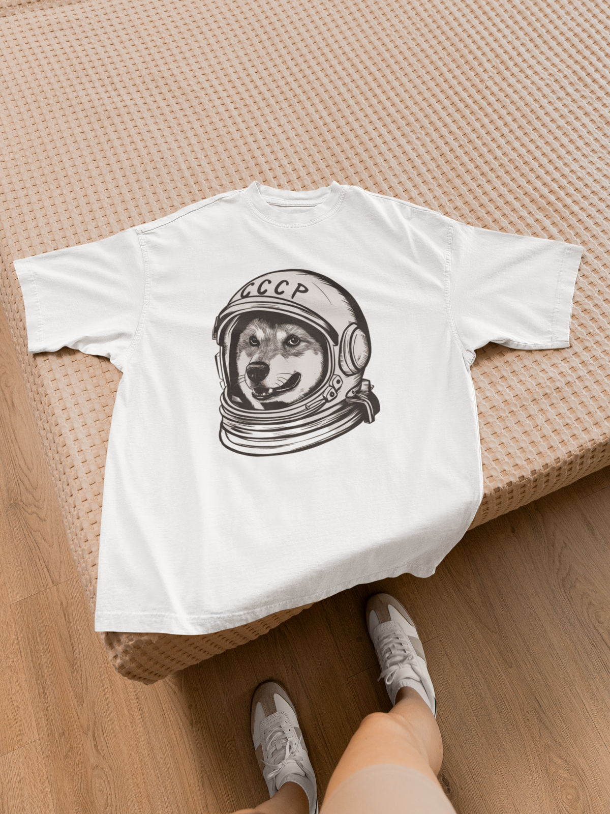 CCCP Astronaut Dog T-Shirt in white, flat lay on wood floor with sneakers, funny quirky graphic tee gift