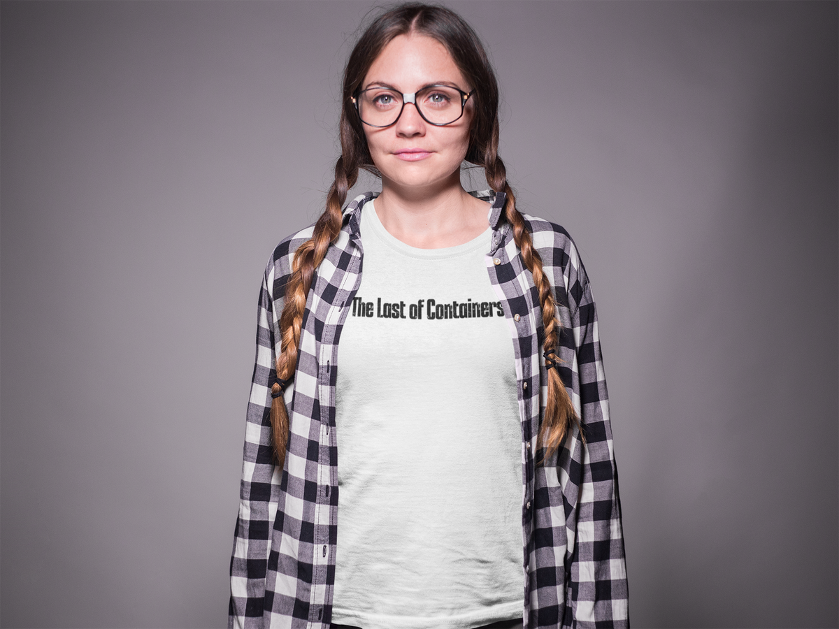 'The Last of Containers' T-shirt in white, woman with glasses wearing it, purple backdrop, coder gift tee