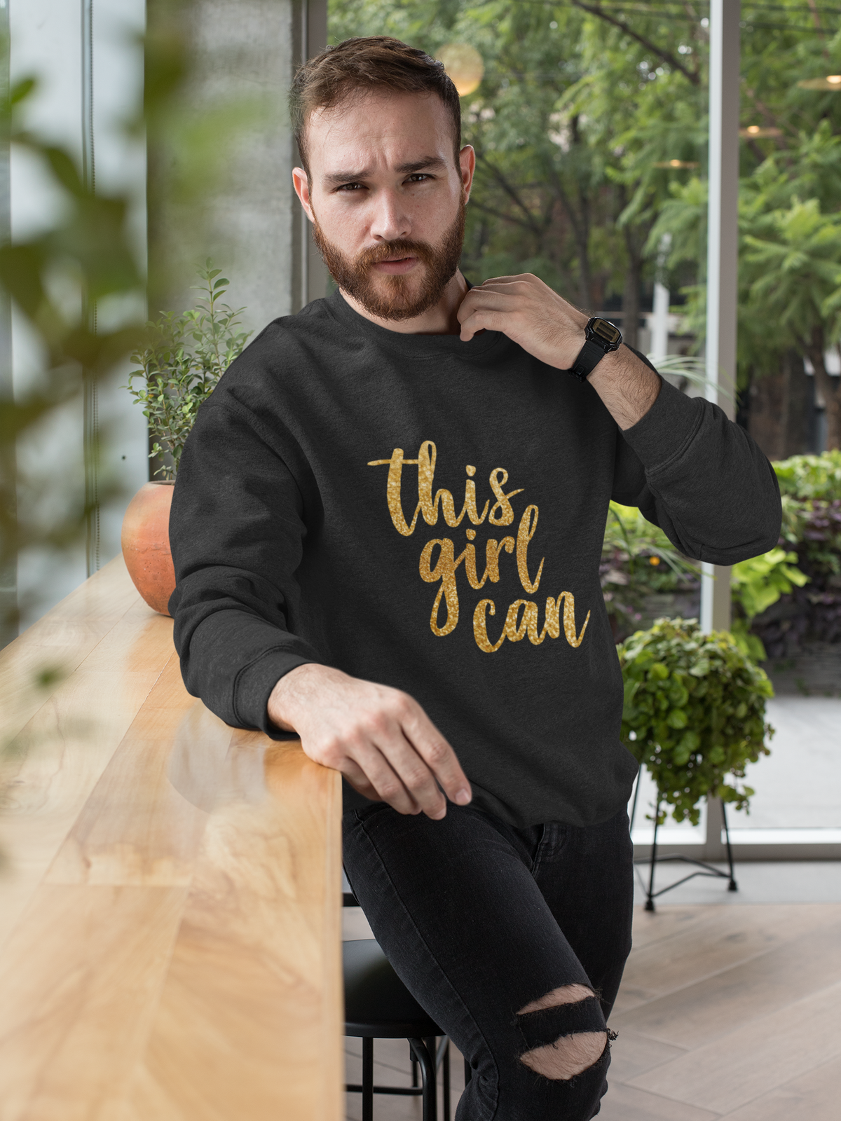 This Girl Can crewneck sweatshirt in black, bearded man wearing it outdoors, motivational gift