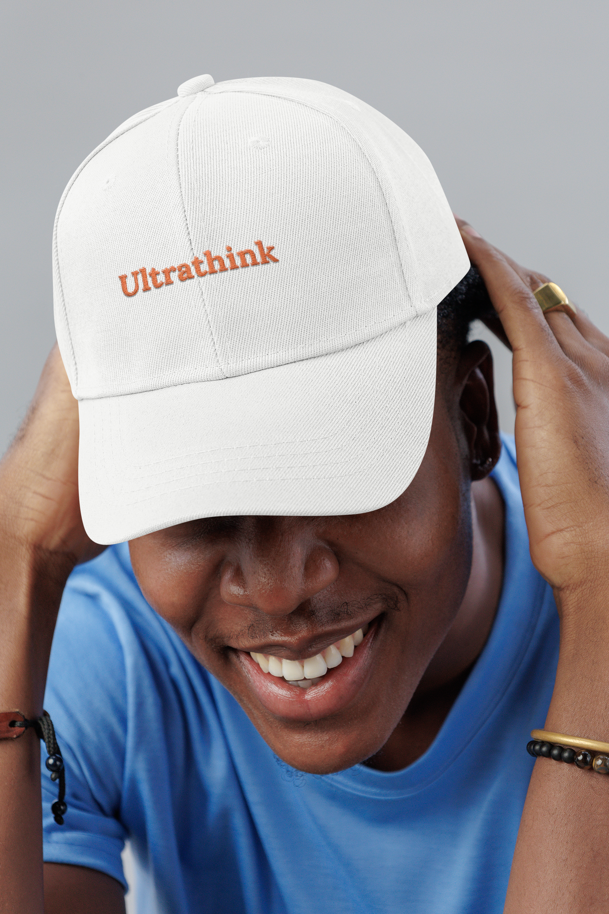 Ultrathink Claude Code dad cap, smiling man in a studio, lifestyle mockup, Geekpsters