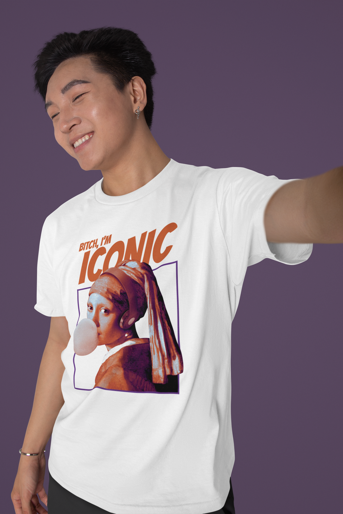 'Bitch, I'm Iconic' t-shirt in white, man model taking a selfie wearing it, funny pop art graphic gift