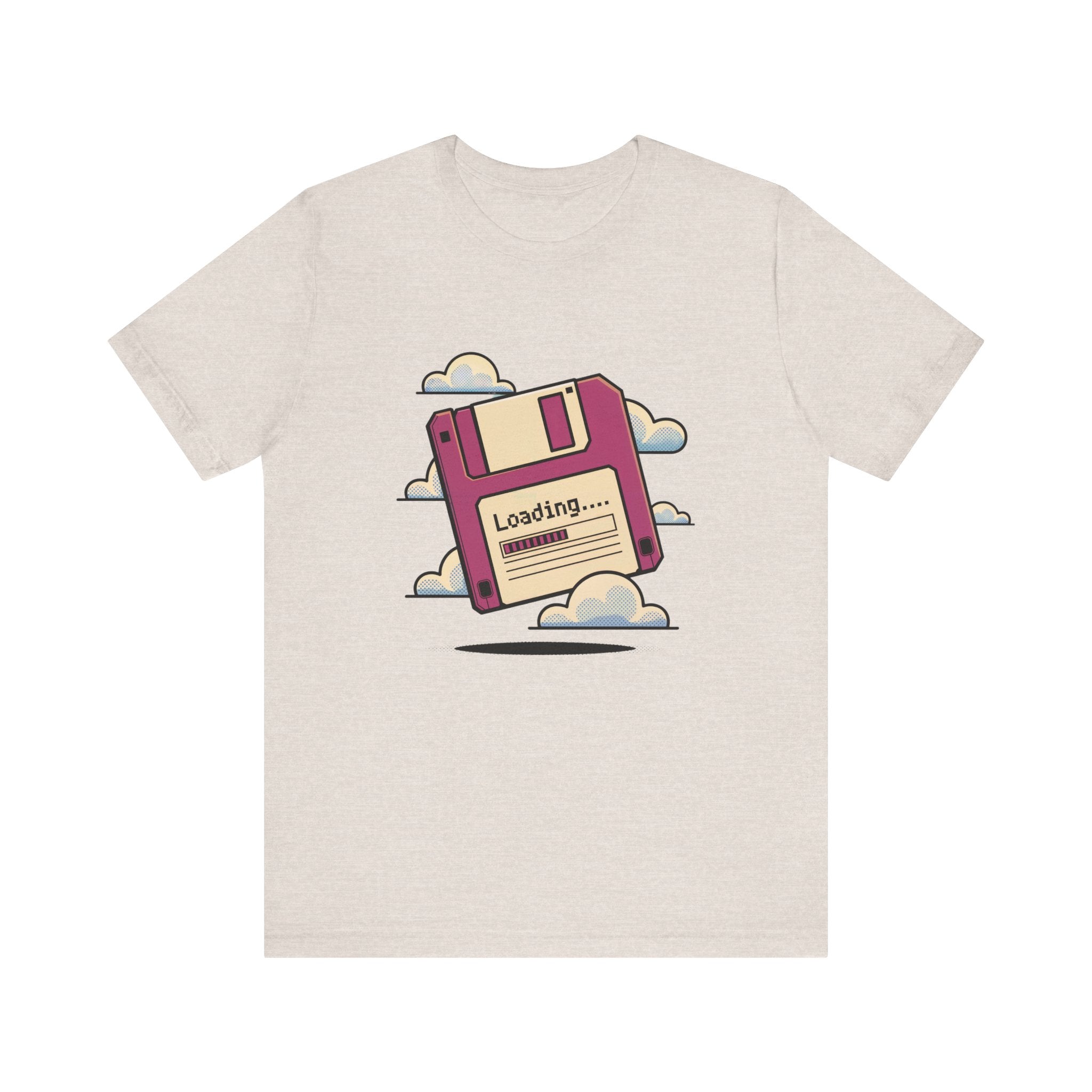 The Floppy disk -T Shirt is a soft cotton beige tee with a large illustrated floppy disk and "Loading..." text amid clouds, featuring tapered shoulders for a modern fit.