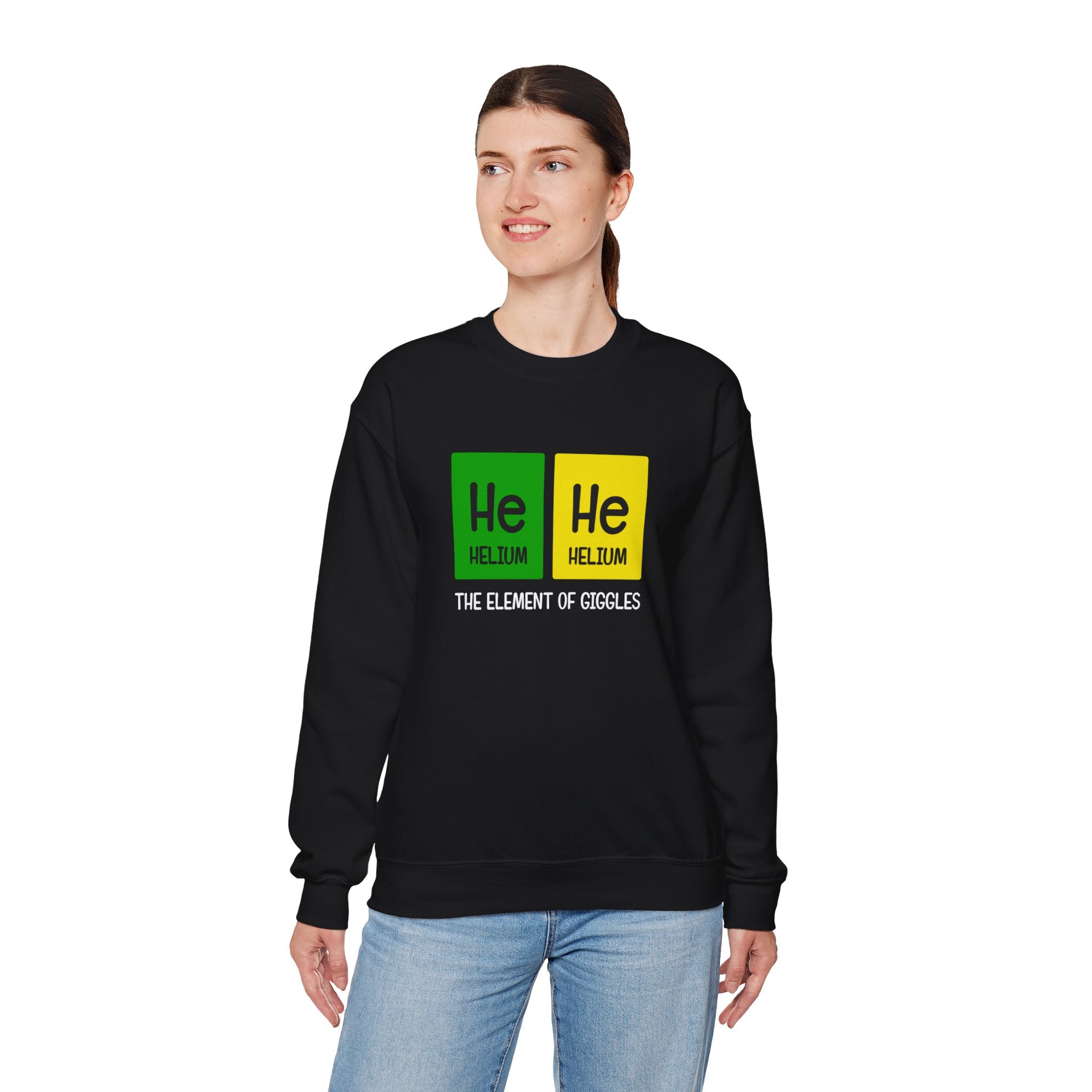 Someone wears the He-He - Sweatshirt, crafted from ultra-soft fabric, showcasing "He He Helium The Element of Giggles" with periodic table-inspired graphics on the front.