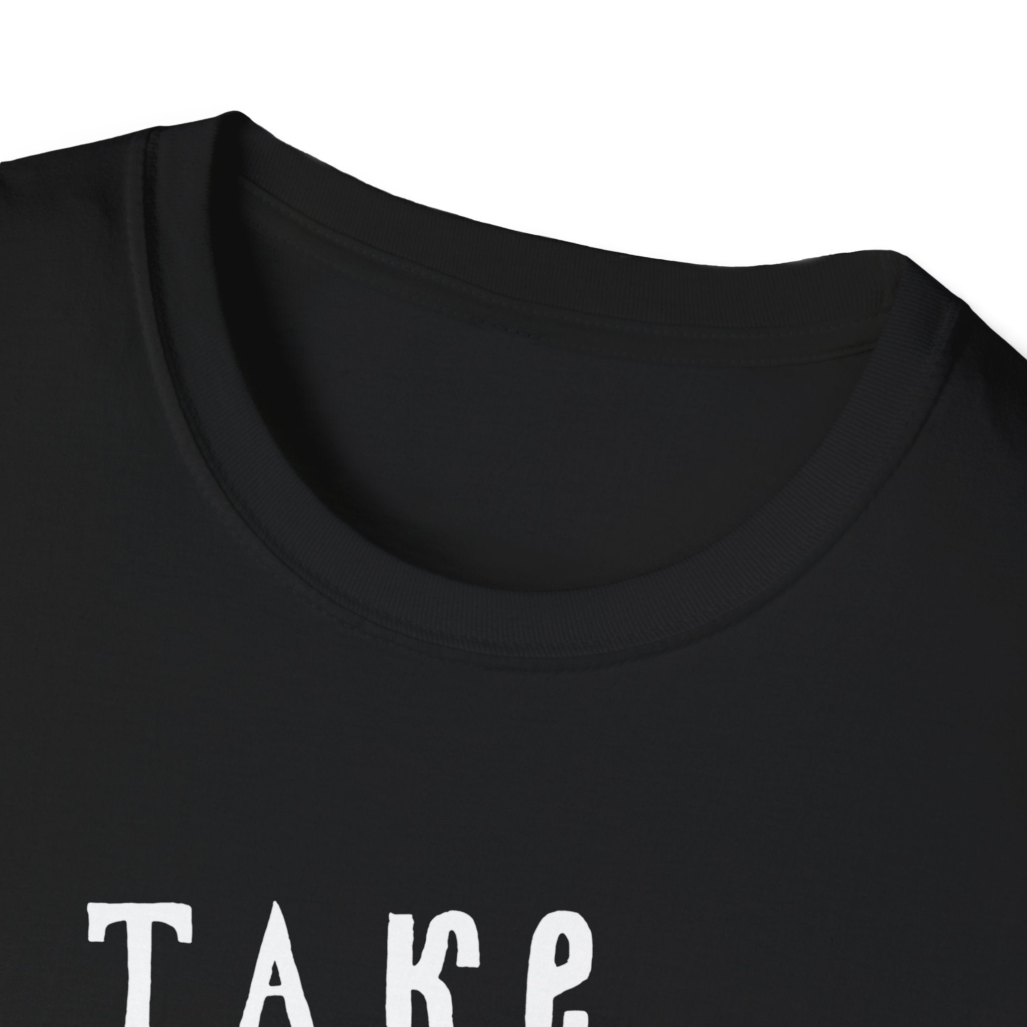 Close-up of a black "Take Me to the Ocean" T-Shirt showing partial white text "Take," merging comfort and style with ease.