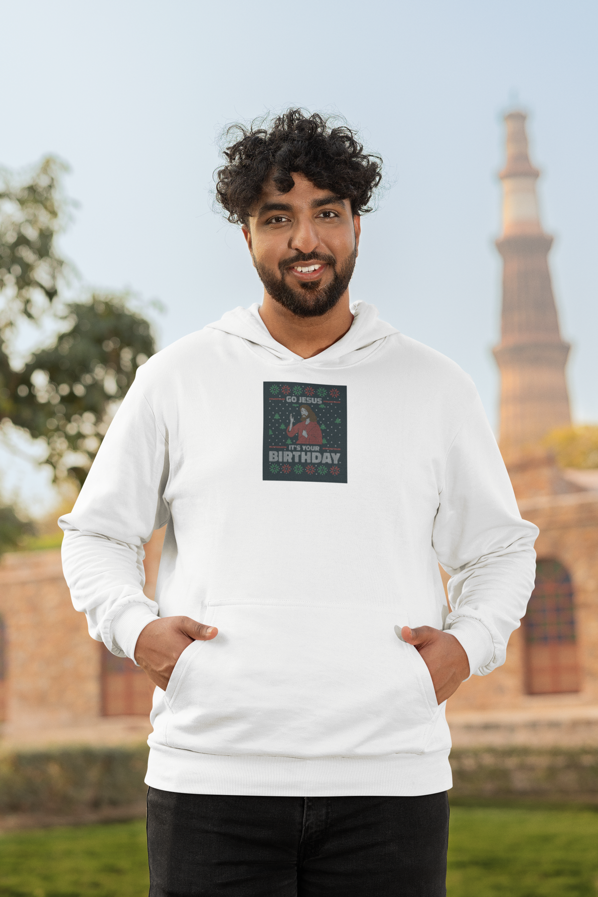 'Go Jesus It's Your Birthday Ugly Sweater Hoodie' in white, man by a historic building, Hoodie mockup, Geekpsters