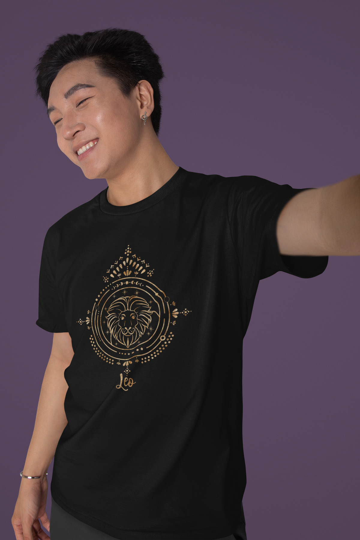 Leo zodiac T-shirt in black, man wearing it with arms outstretched, astrology gift shirt