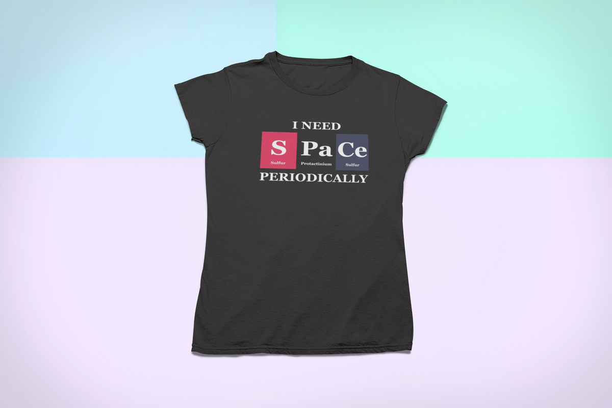 'I Need Space Periodically' periodic table t-shirt in black, flat lay on pastel background, funny gift
