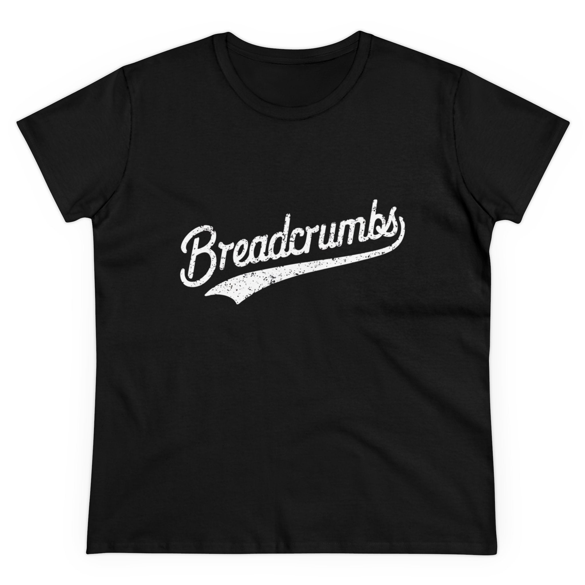 The Breadcrumbs - Women's Tee is a black t-shirt featuring the word "Breadcrumbs" in a white, distressed script font across the front. This semi-fitted women's t-shirt is crafted from soft cotton for ultimate comfort.