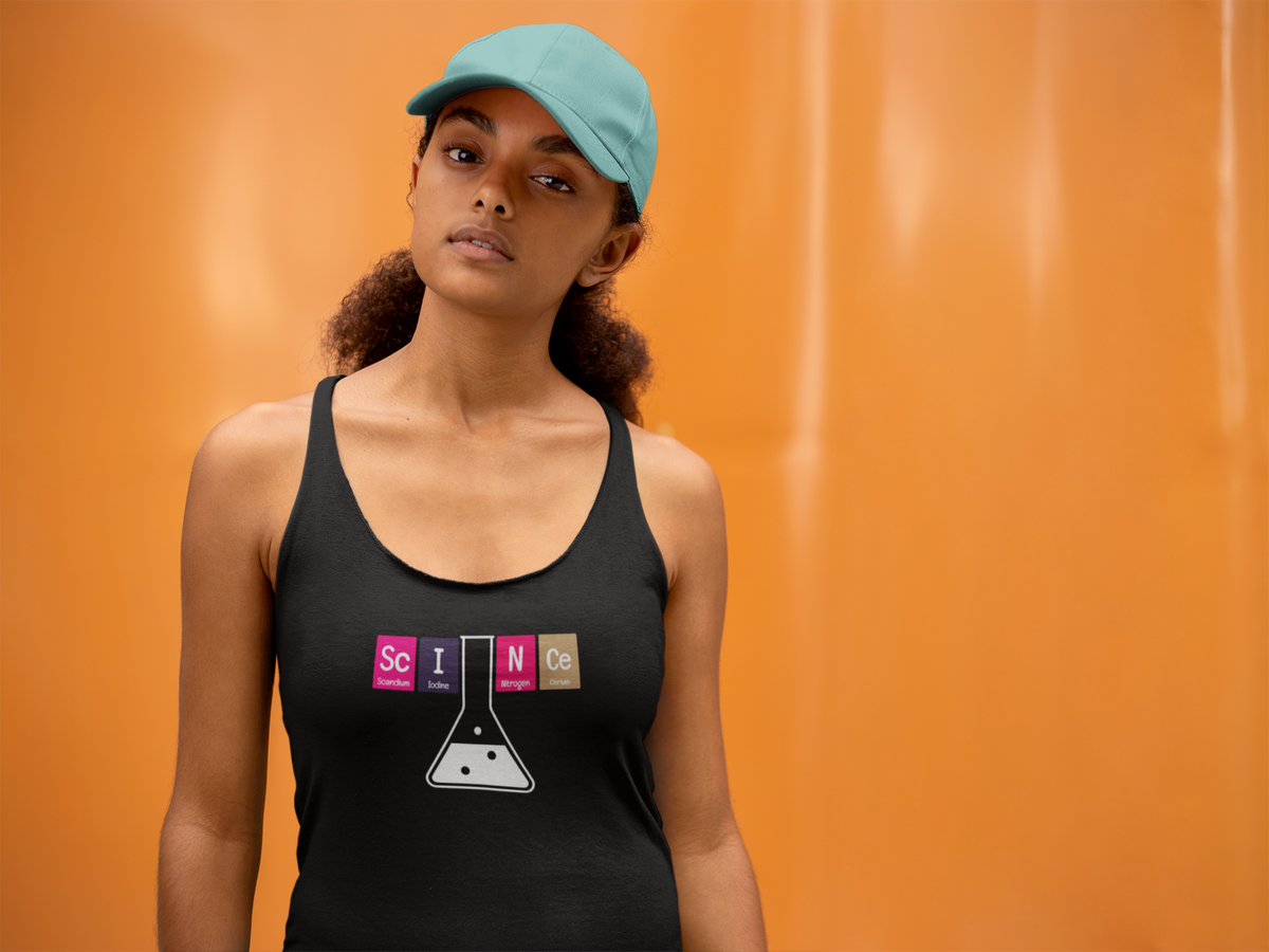 'Sc-I-N-Ce Periodic Table Women's Tank' in black, woman by an orange wall, Tank Top mockup, Geekpsters