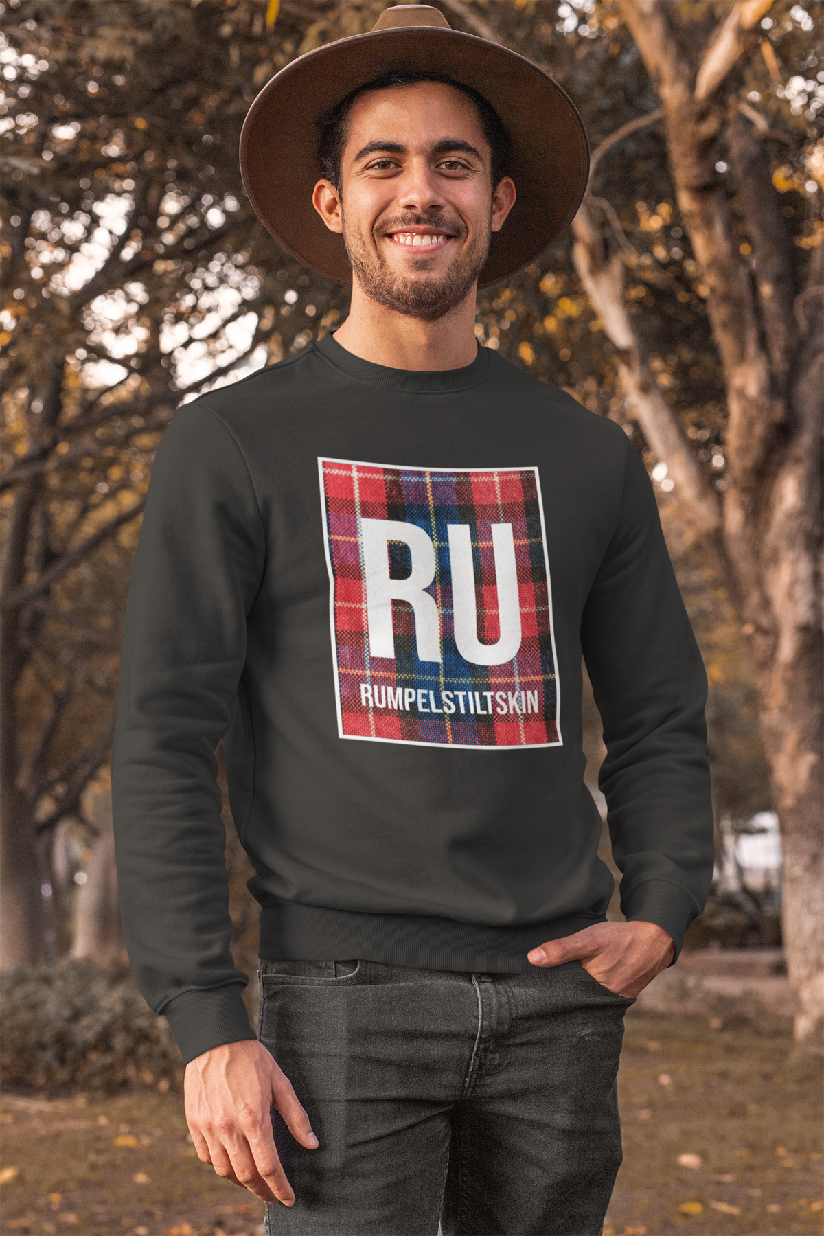 'RU Rumpelstiltskin' periodic table sweatshirt in charcoal, man wearing it outdoors, funny pun gift