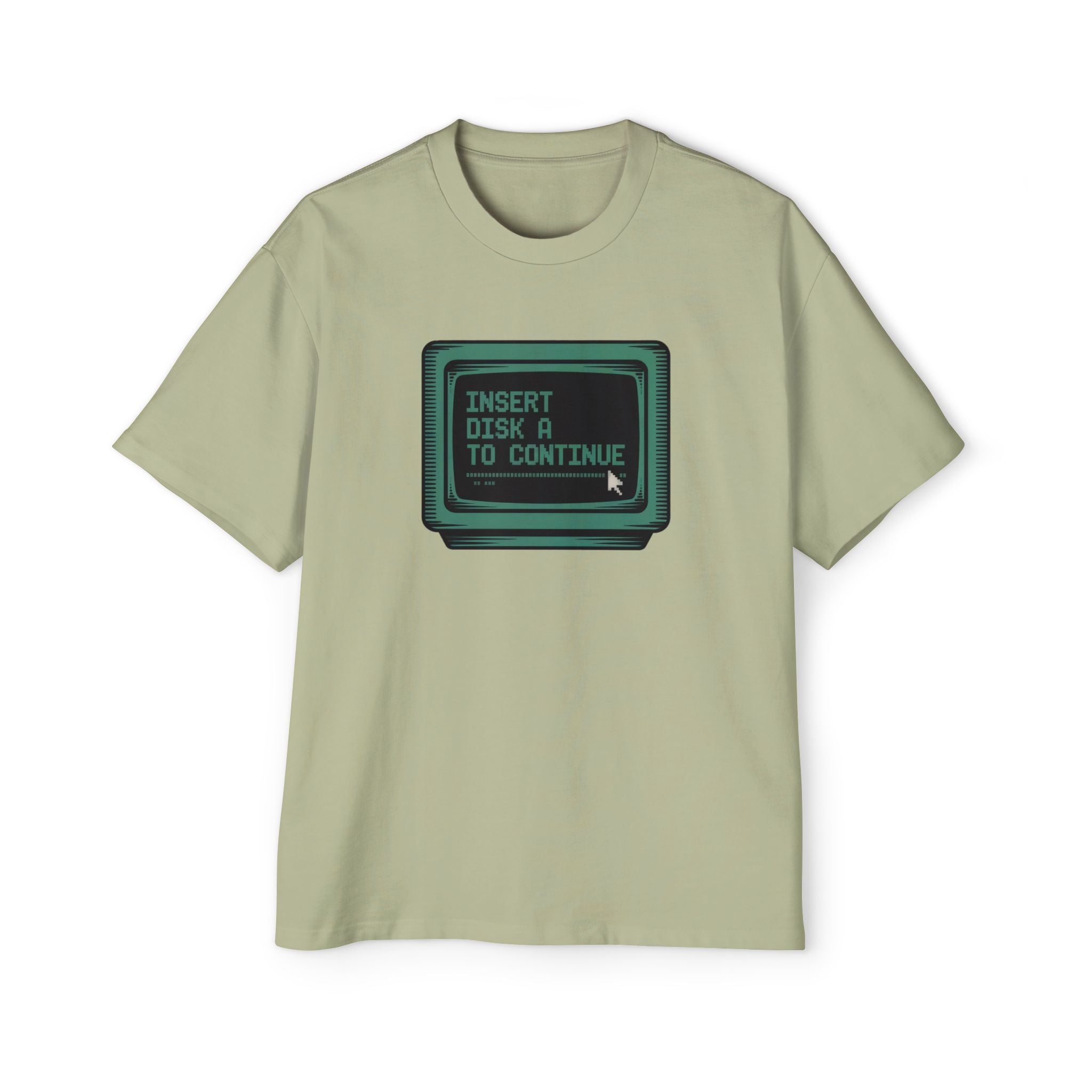 The Insert Disk A to Continue - Heavy Oversized Tee in light green features a vintage computer monitor with "INSERT DISK A TO CONTINUE" and a cursor, perfect for fans of retro tech and coding nostalgia.