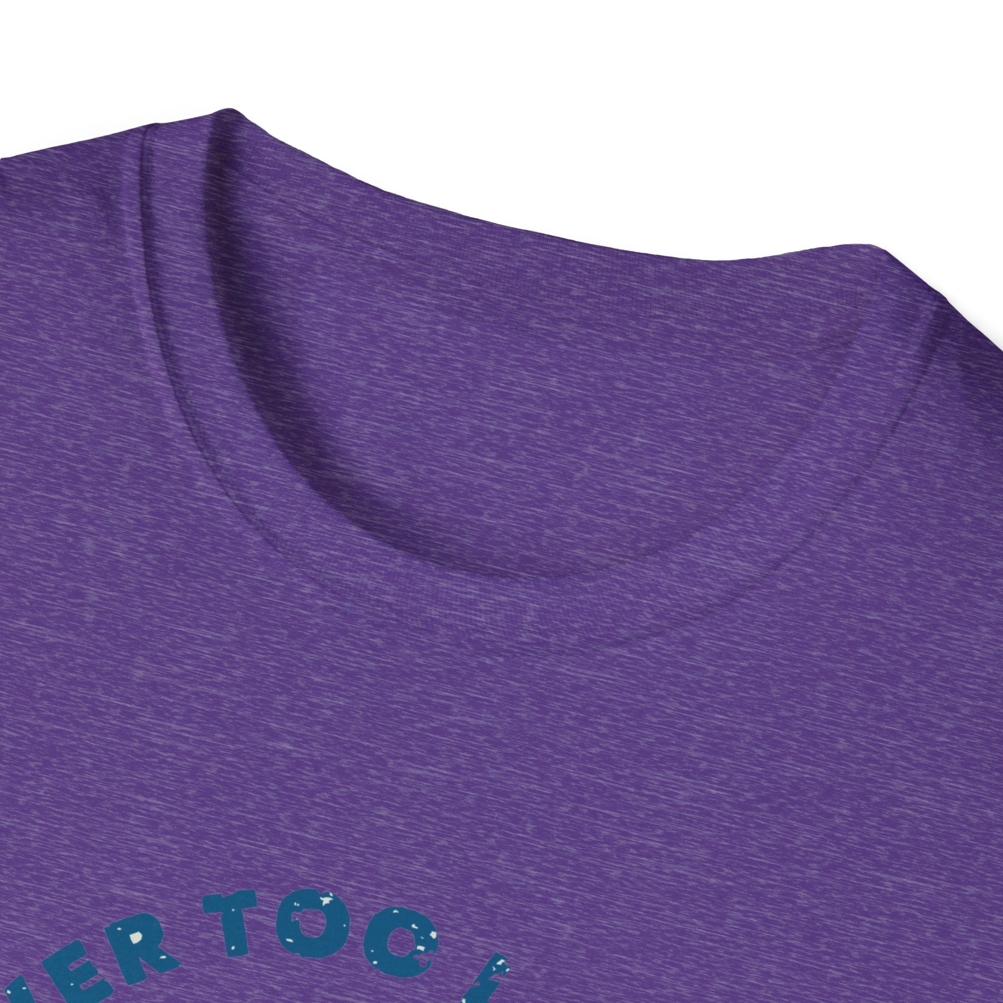 A close-up of a purple "Never Too Late to Skate" T-shirt, featuring partially visible teal lettering at the bottom.