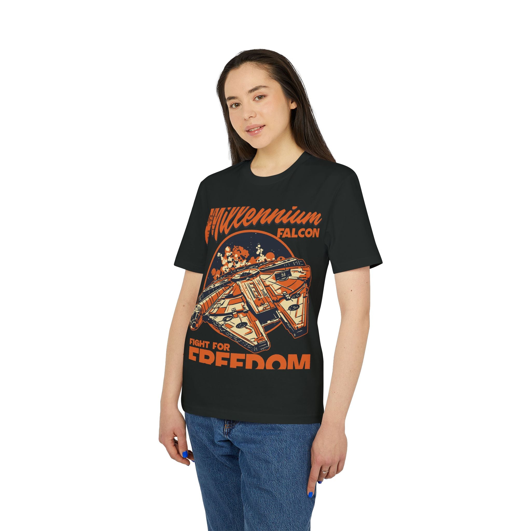 A sci-fi superfan wears a black Falcon - Organic T-Shirt and blue jeans, standing against a white background.