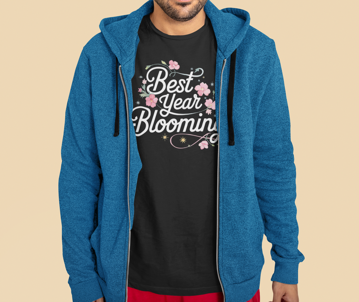 'Best Year Blooming' organic t-shirt in black, man wearing it under blue zip hoodie, cozy plant gift